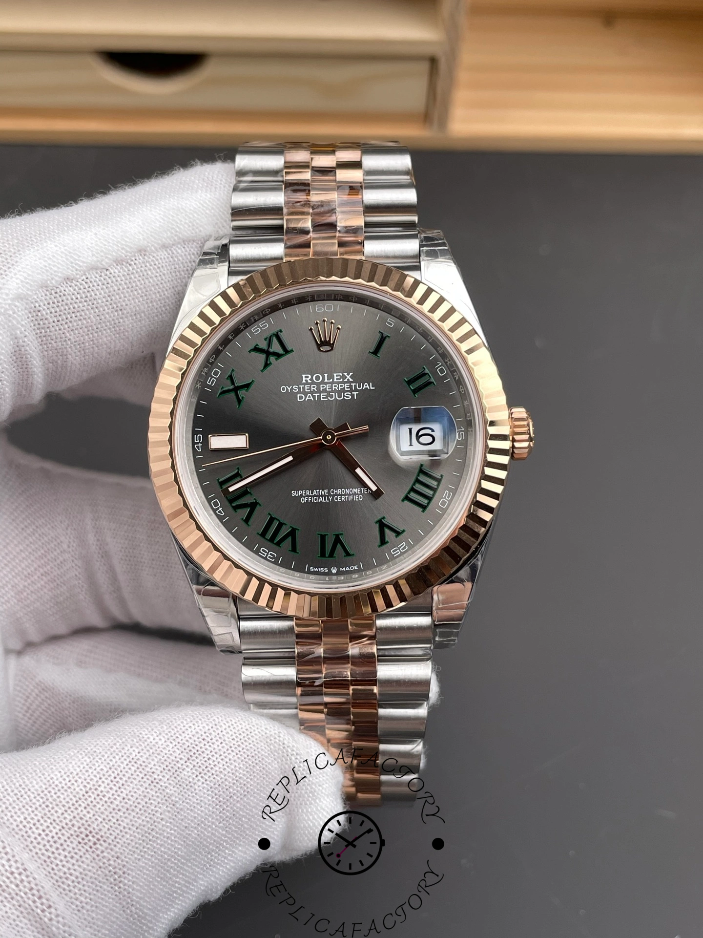 Front view of Rolex Datejust 41 m126331-0016 with slate grey dial and green Roman numerals.