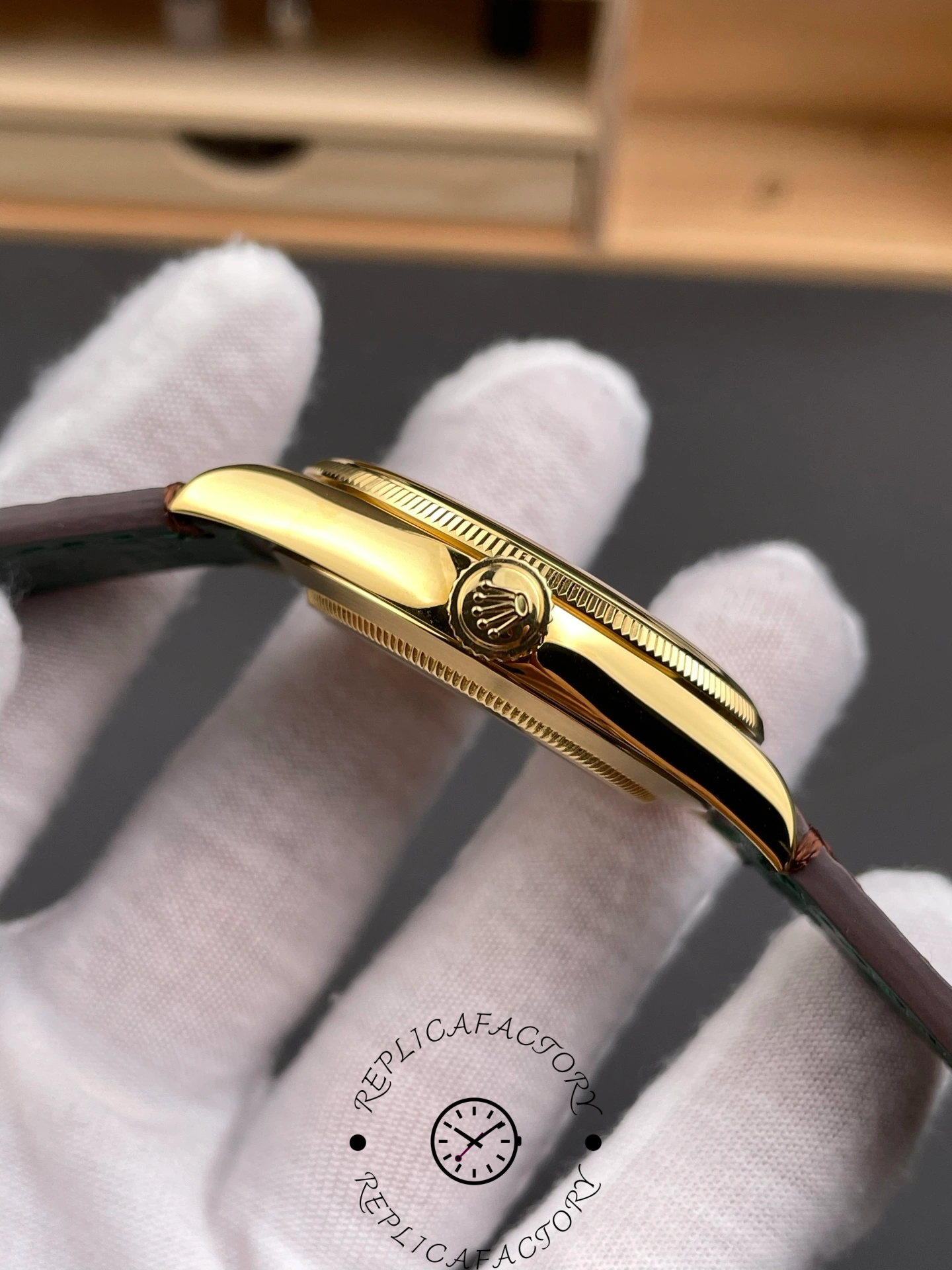 Crown side of Rolex 1908 52508 showing Rolex logo on yellow gold crown.