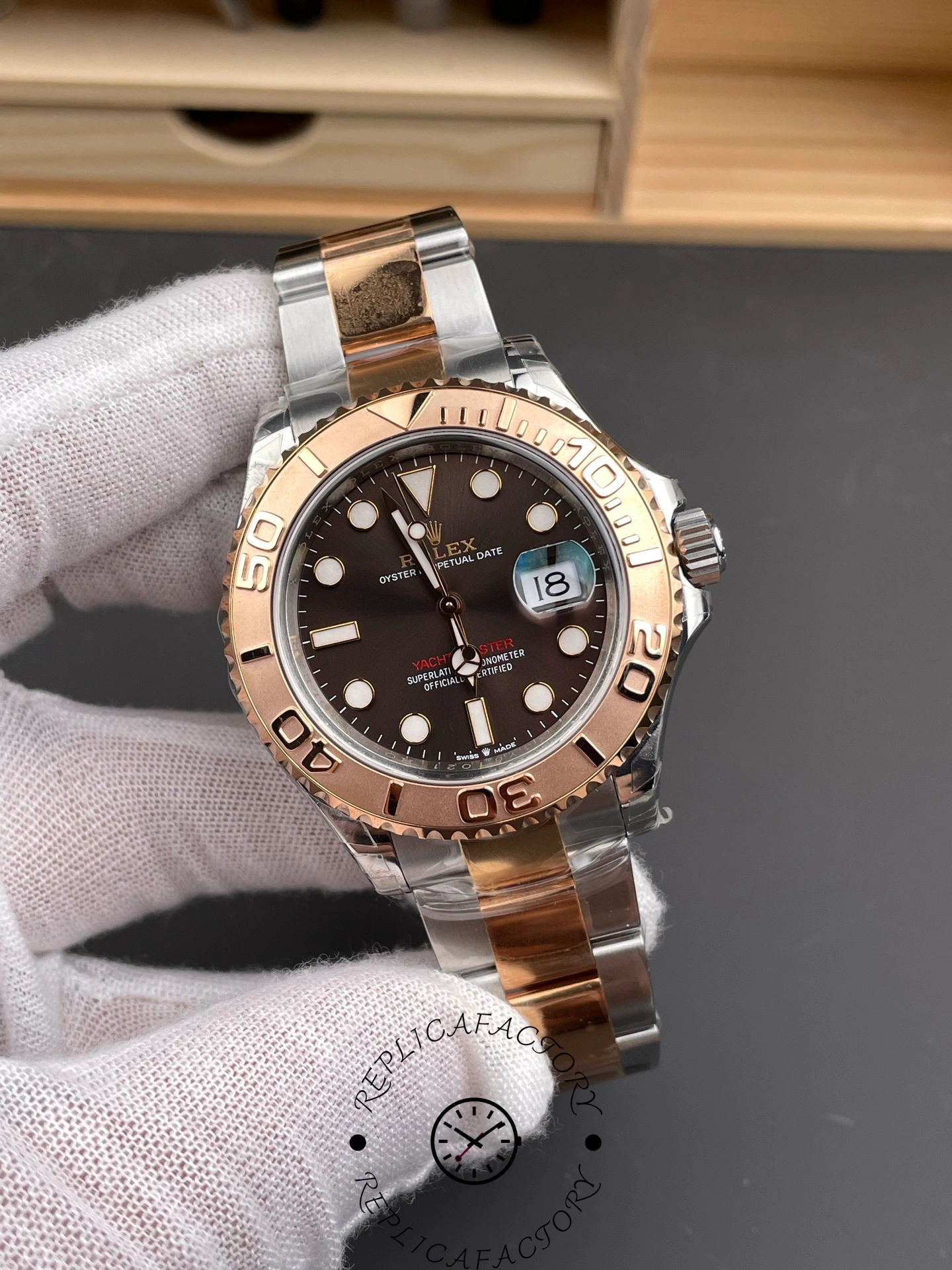 Angled view of Rolex Yacht-Master 126621 highlighting two-tone bracelet and chocolate dial.