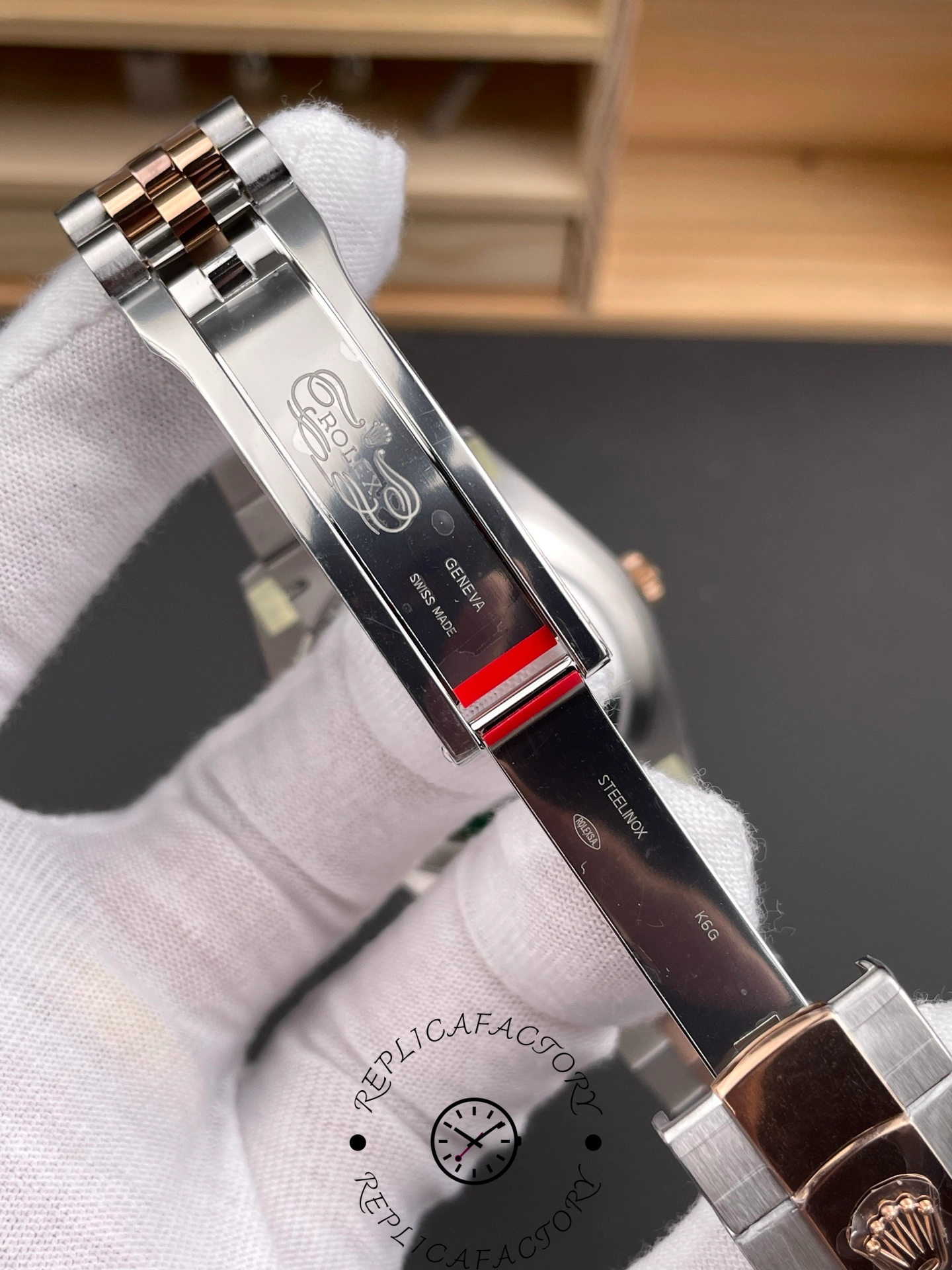 Inner clasp engraving of Rolex Datejust 41 m126331-0016 showing logo and Swiss marks.