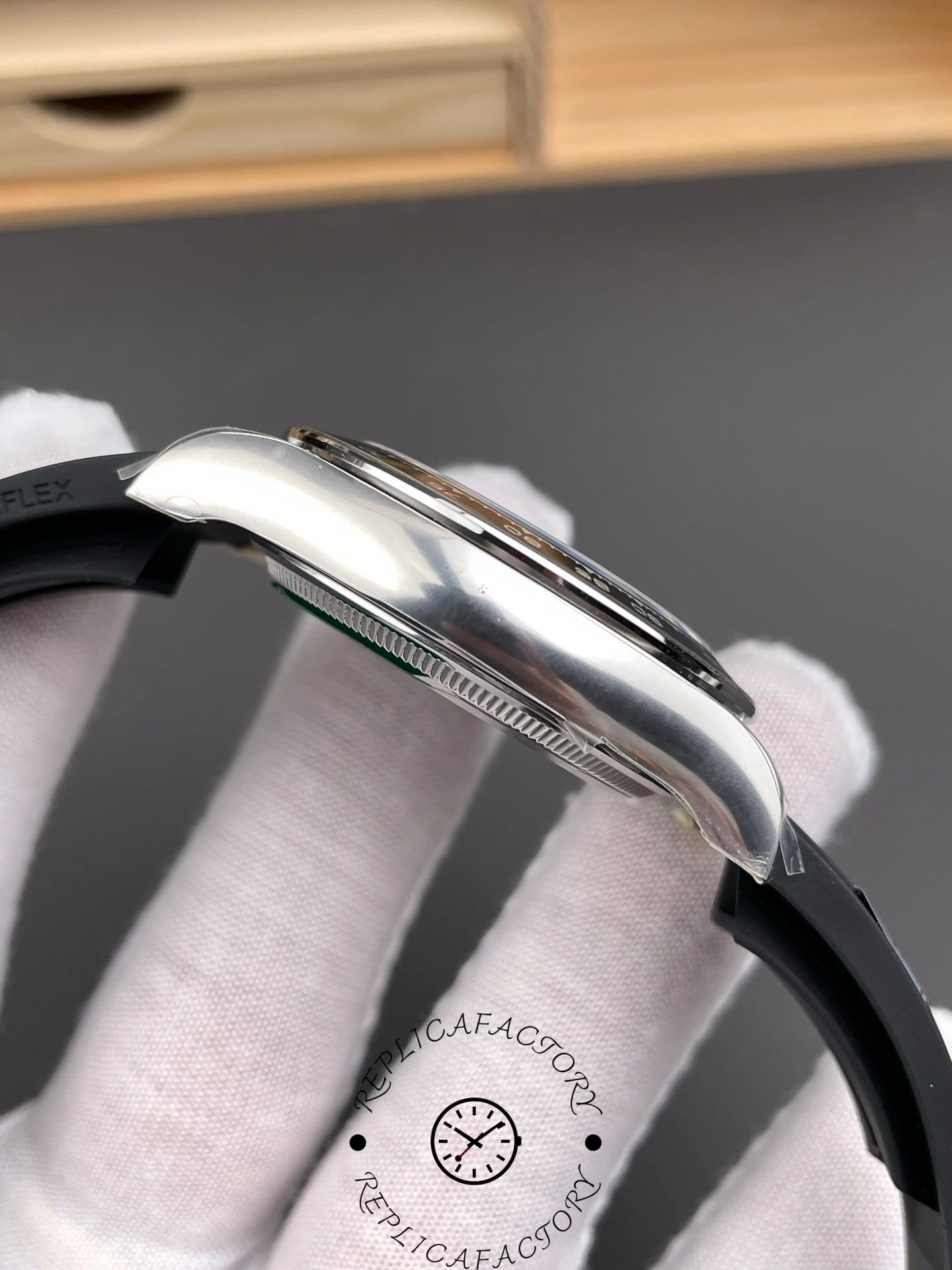 Left side of Rolex Daytona 126519LN showing polished white gold case and curved lugs.