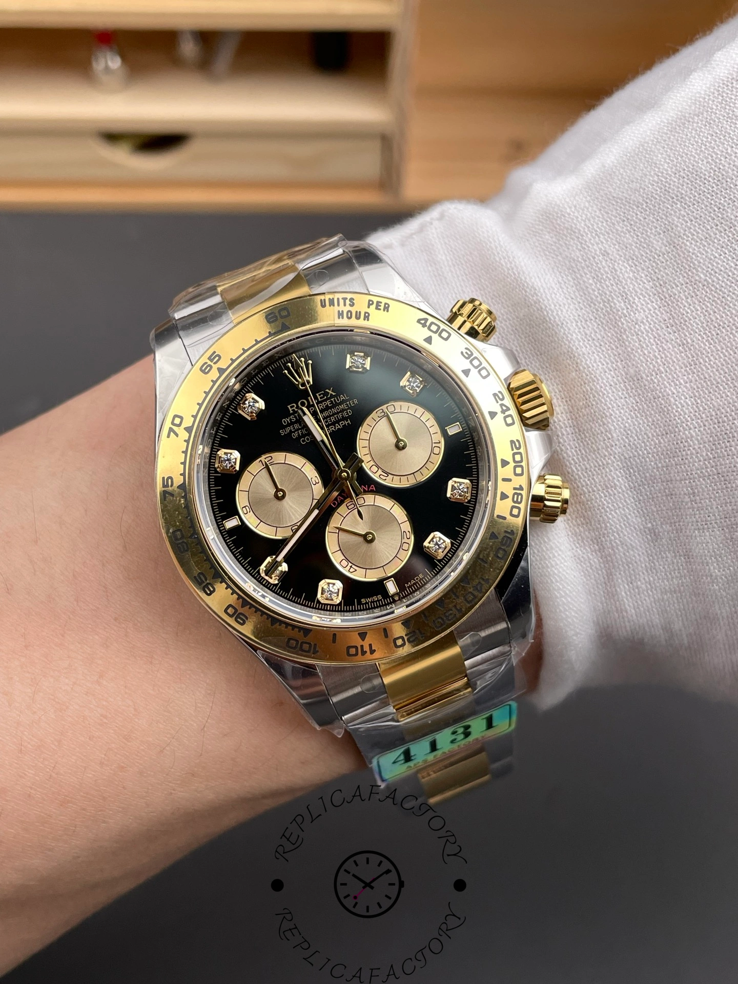 Wrist shot of Rolex Daytona 126503-0002 black diamond dial two-tone bracelet.