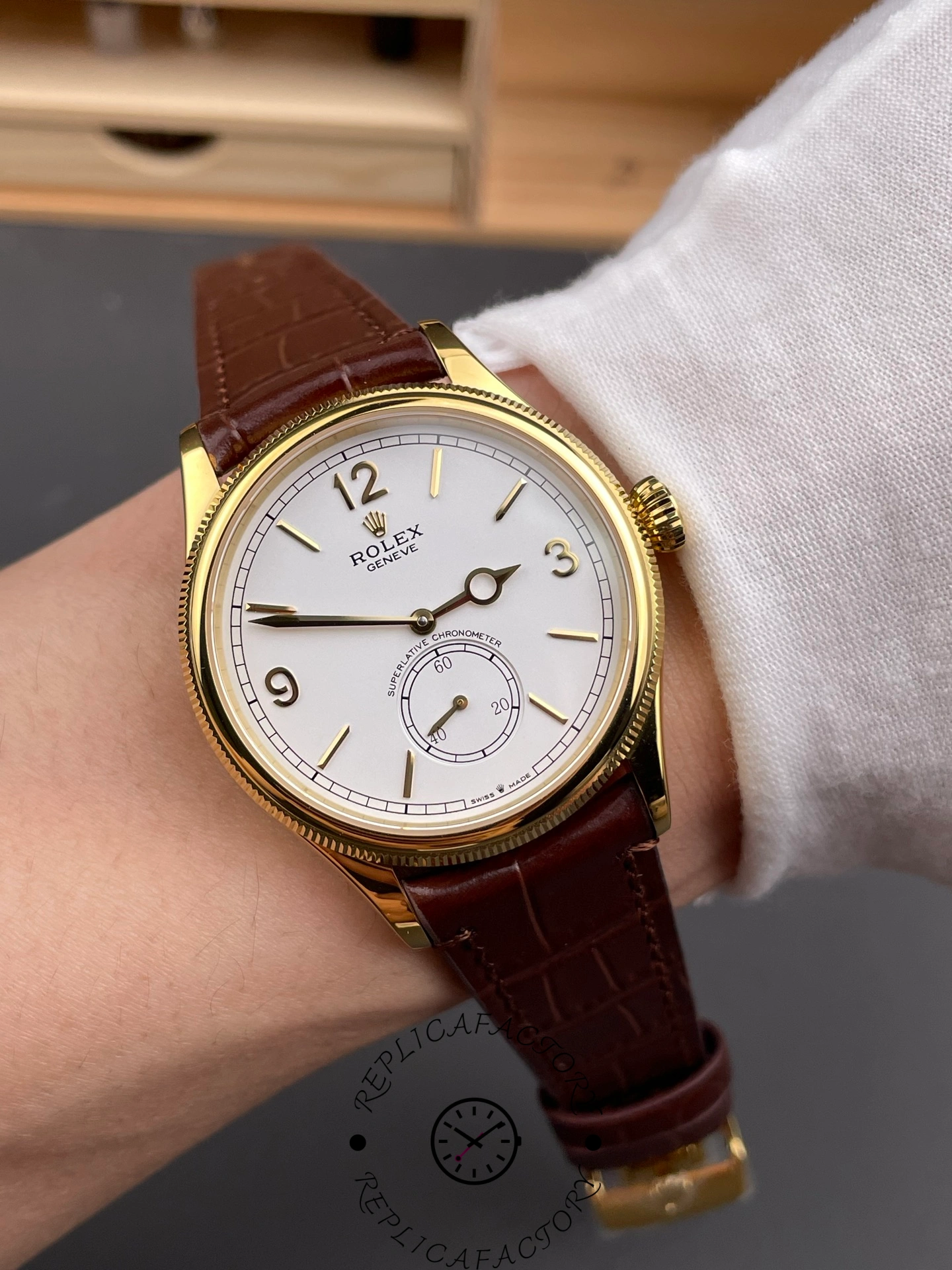 Wrist shot of Rolex 1908 52508 showing white dial and brown alligator strap.