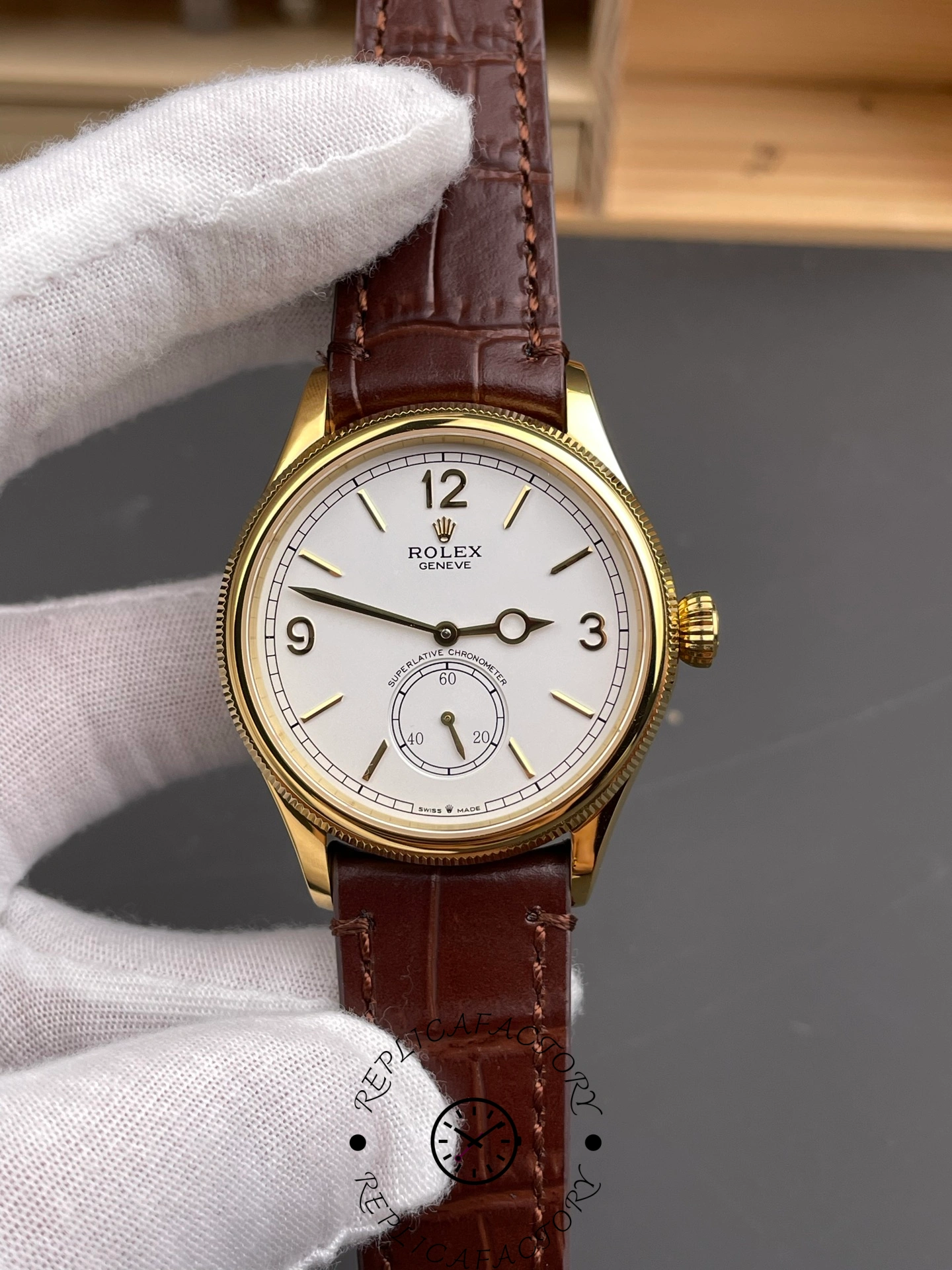 Close-up of Rolex 1908 52508 showing white dial, gold hands, and sub-seconds counter.