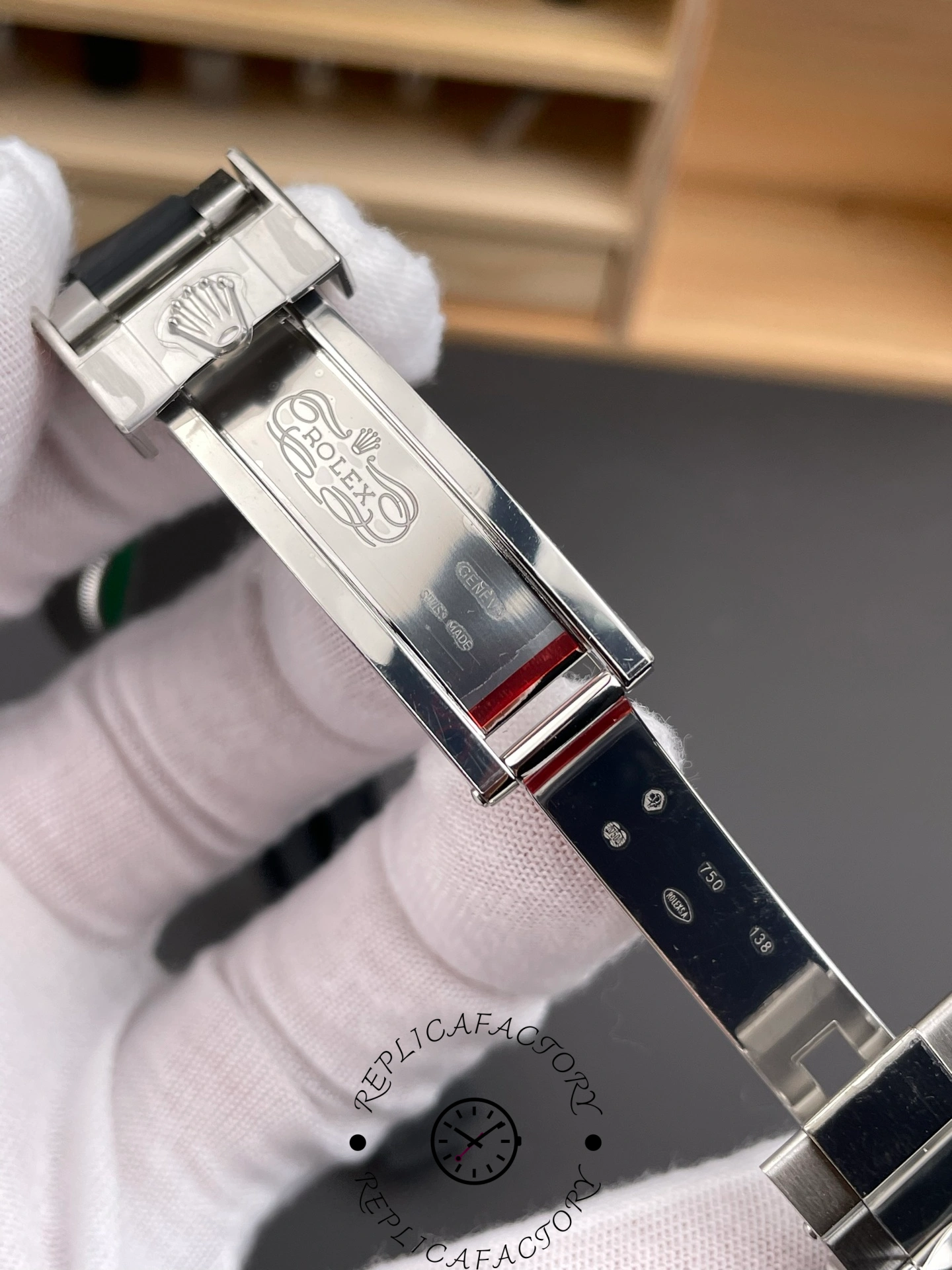 Inner clasp engraving of Rolex Daytona 126519LN-0007 showing logo and Swiss hallmarks.