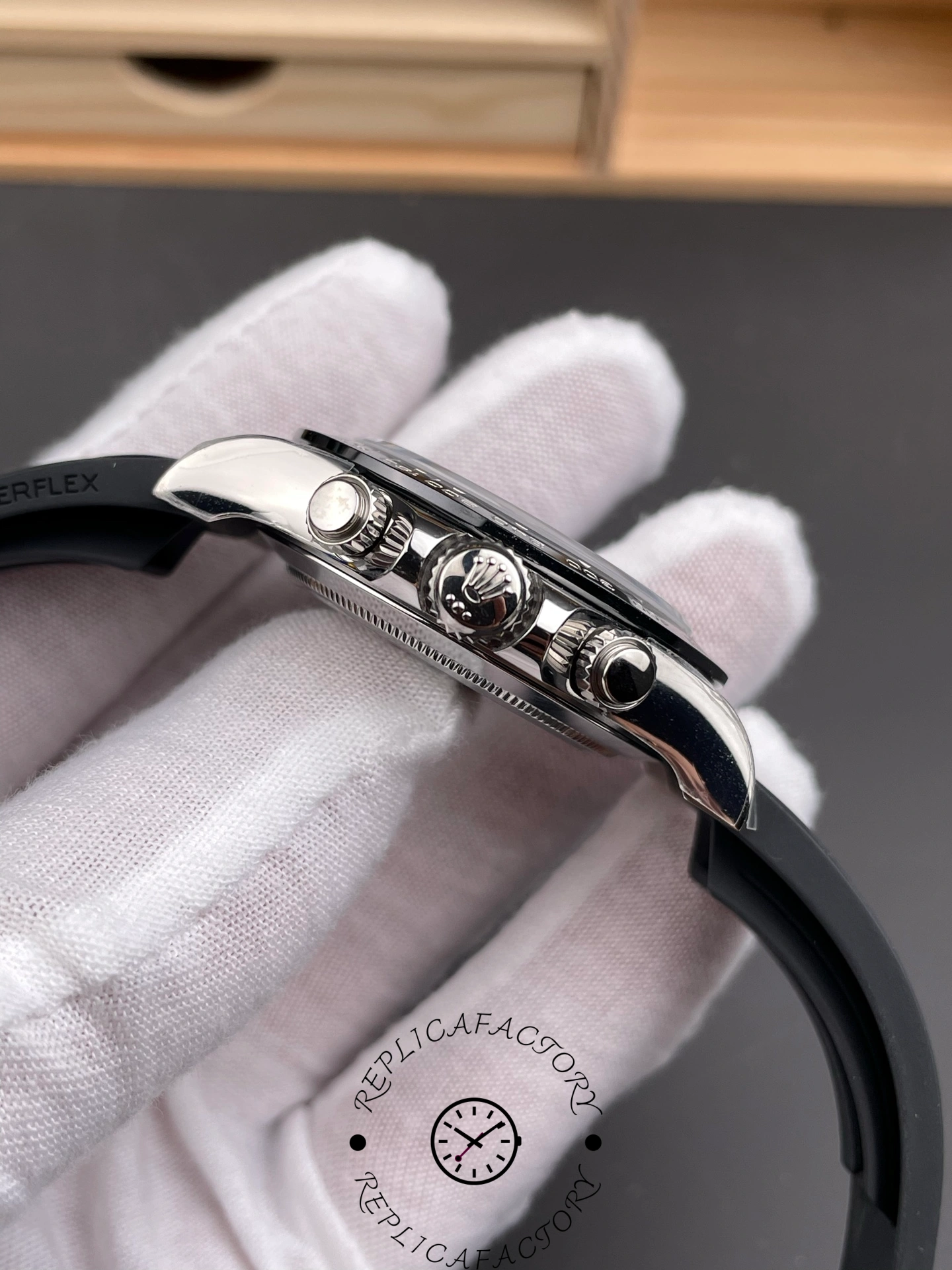 Side view of Rolex Daytona 126519LN-0007 showing crown and pushers with polished finish.