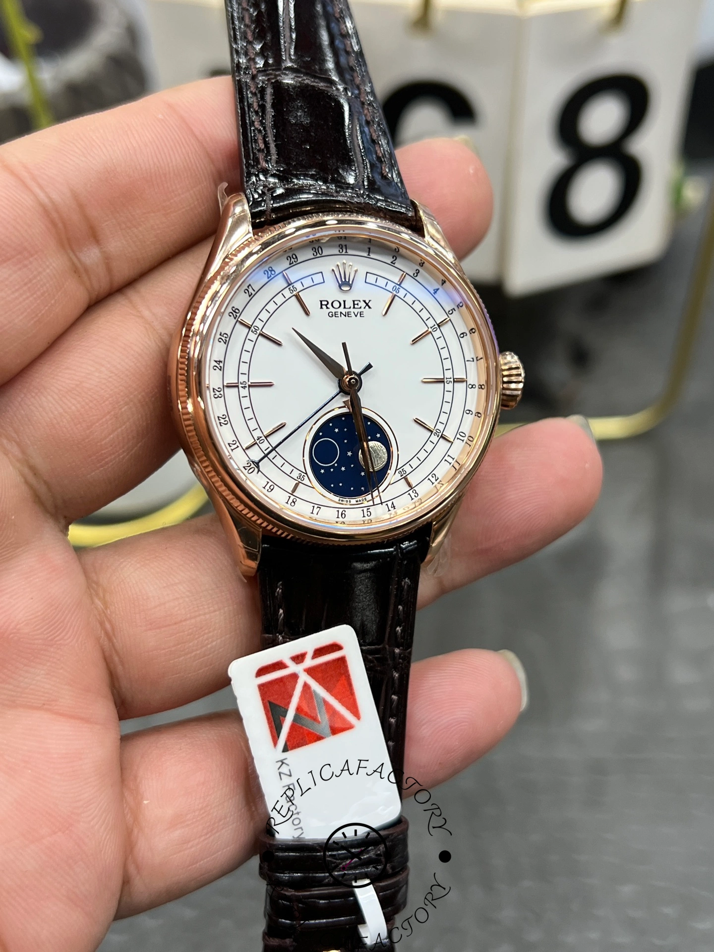 Close-up of Rolex Cellini 50535 with Everose gold crown and polished case.