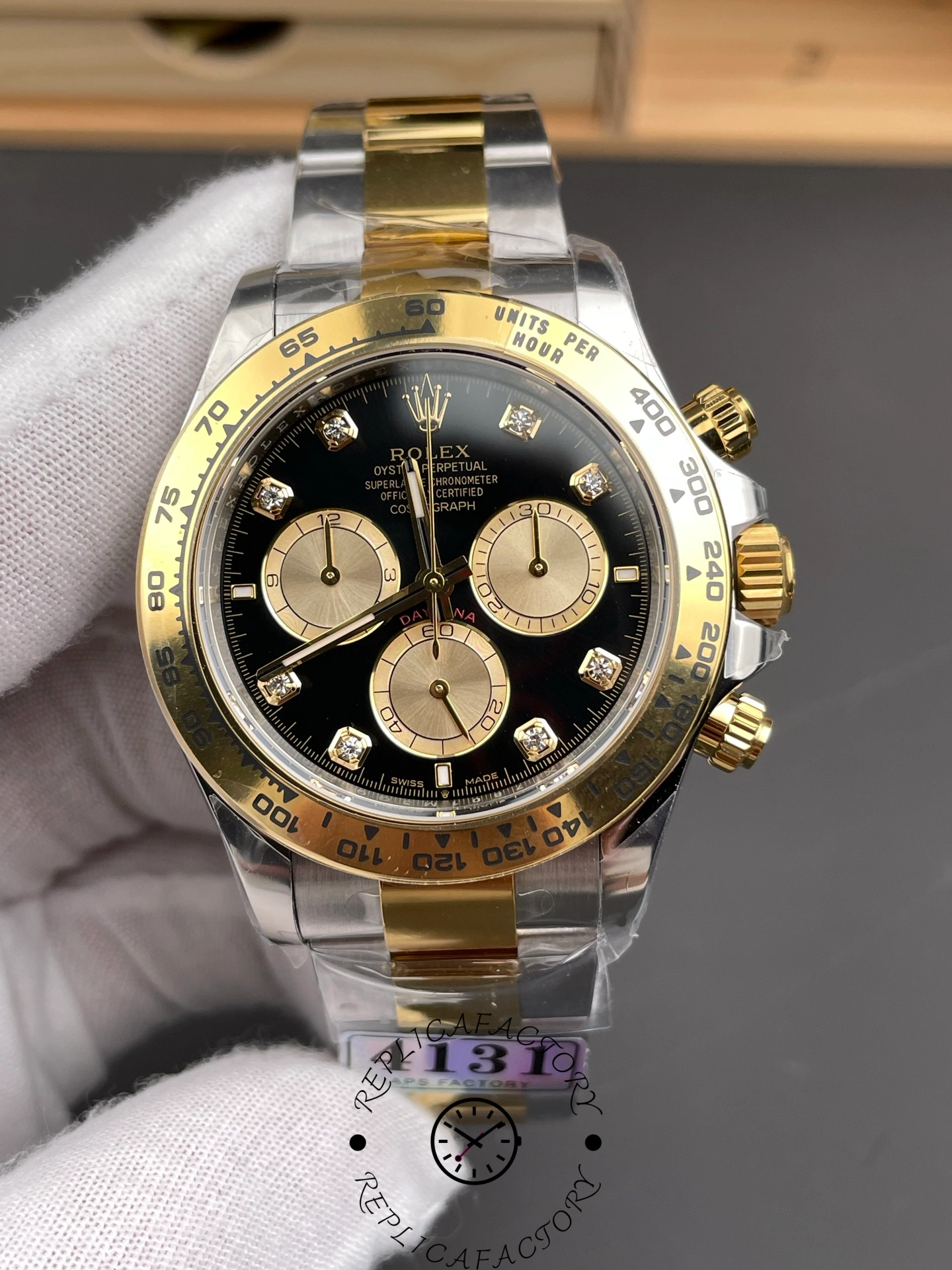 Close-up of Rolex Daytona 126503-0002 highlighting black dial and diamond indexes.