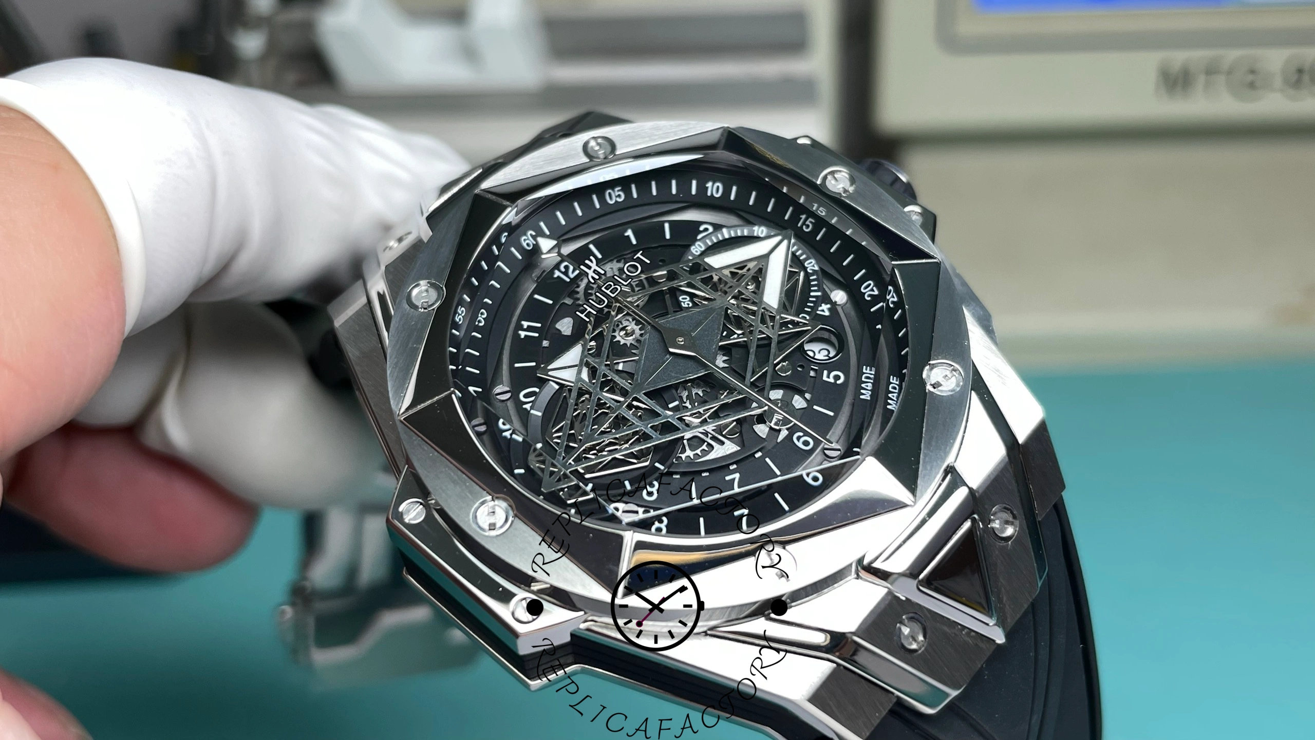 Close-up of Hublot Big Bang Sang Bleu II Titanium dial showing geometric hands.