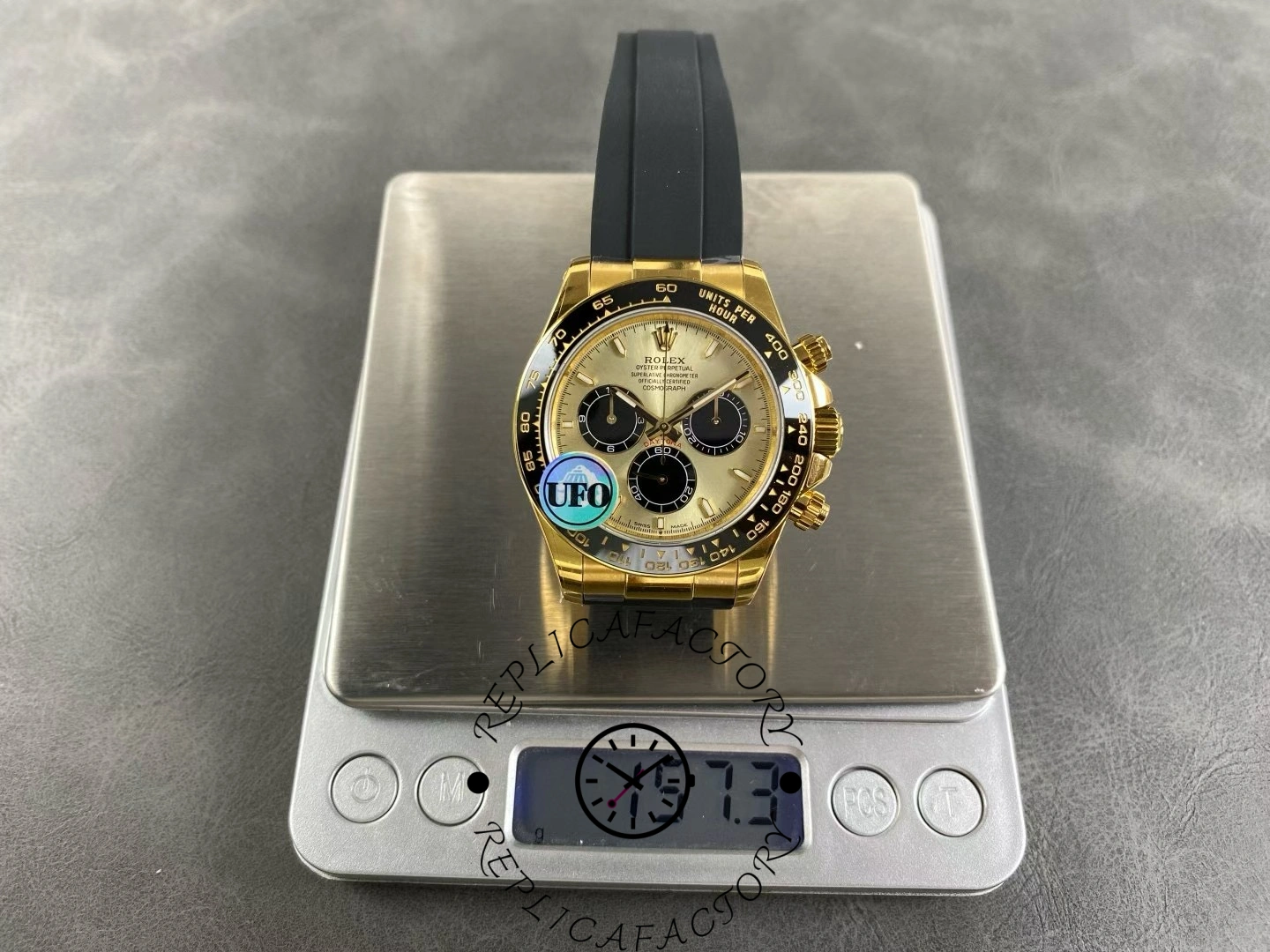 Rolex Cosmograph Daytona 126518LN on scale showing weight 157.3 grams.