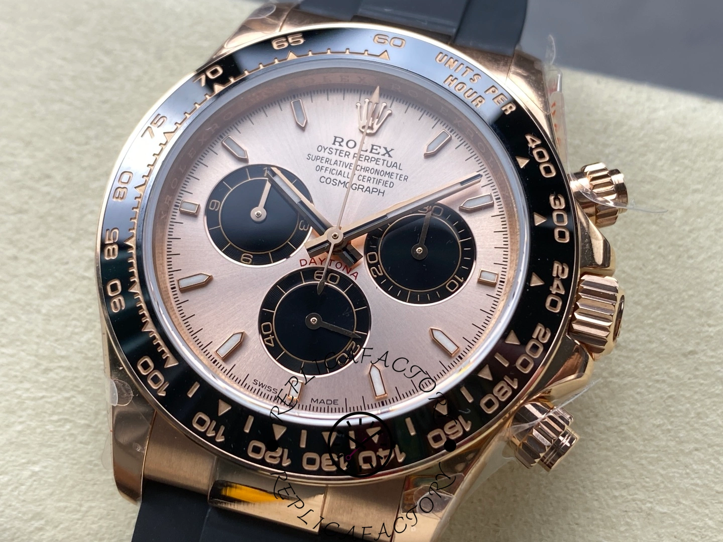 Close-up of Rolex Daytona 126515LN rose gold case and black ceramic tachymeter bezel.