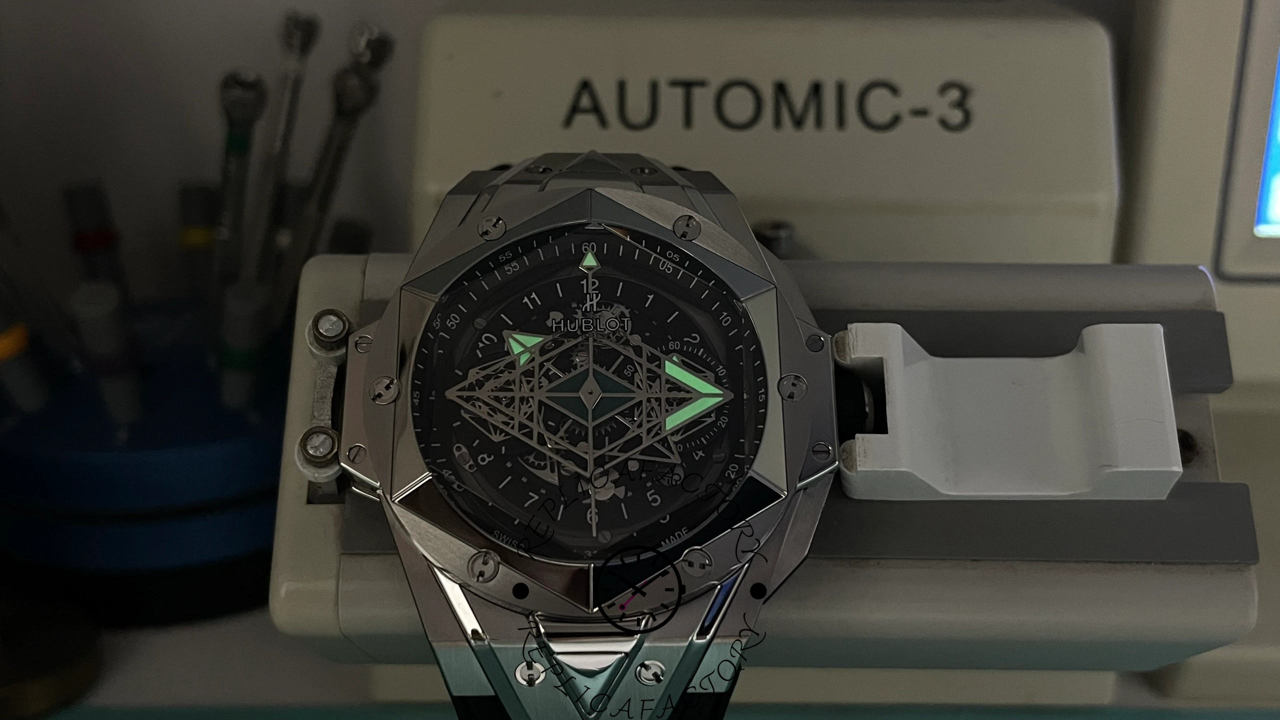 Luminous display of Hublot Big Bang Sang Bleu II Titanium glowing in the dark.