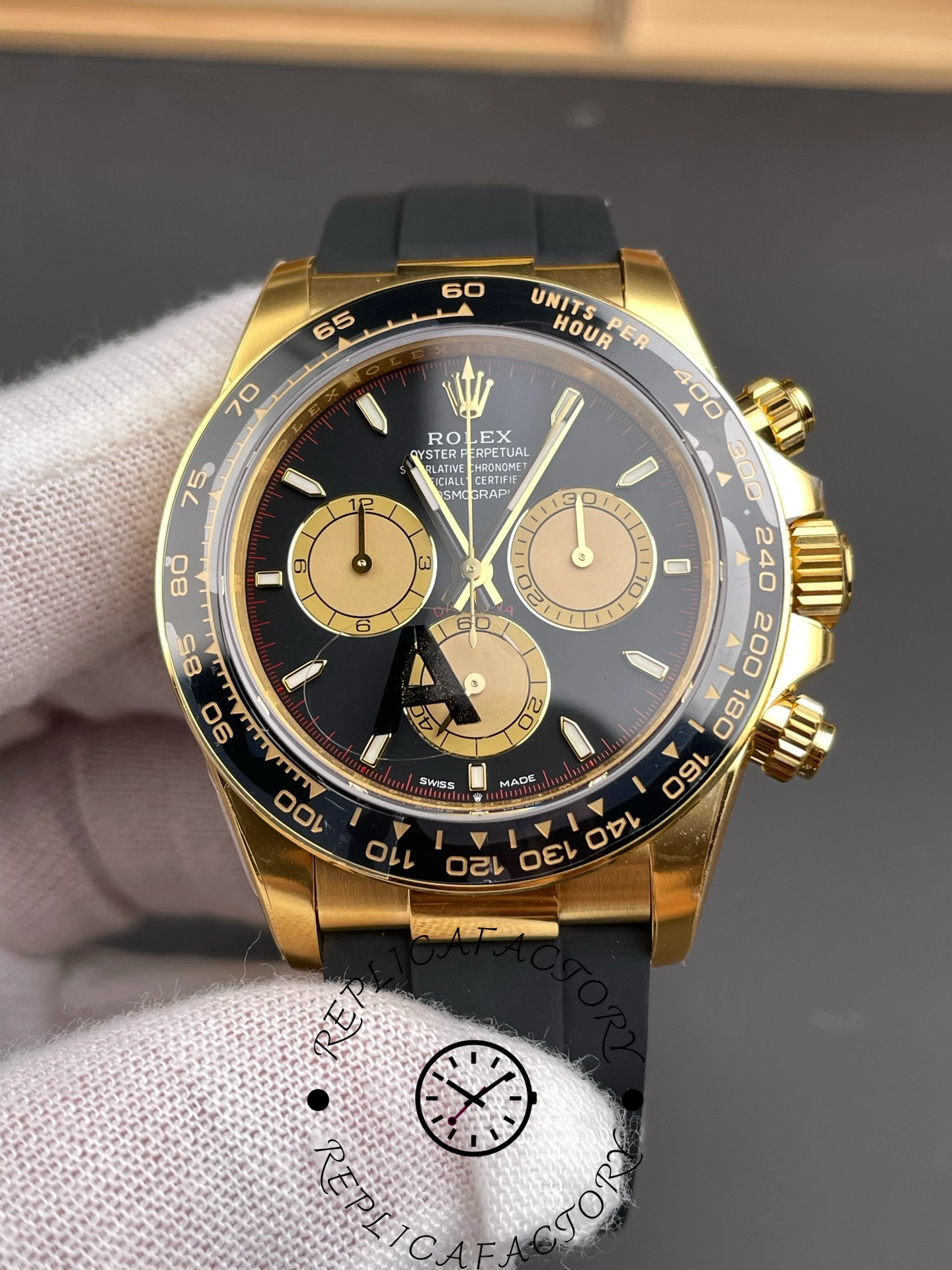 Close-up of Rolex Daytona 126518LN dial showing contrast between black base and gold subdials.