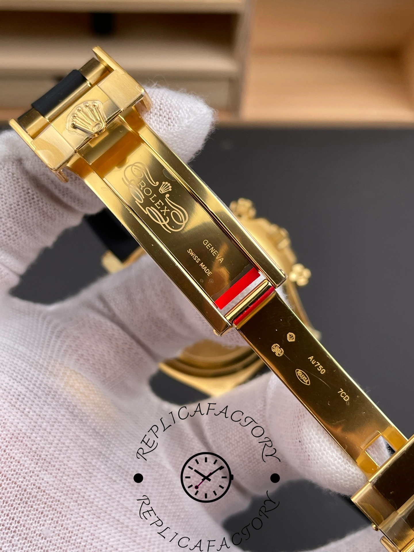 Inside clasp view of Rolex Daytona 126518LN showing engraved Rolex logo and AU750 hallmark.