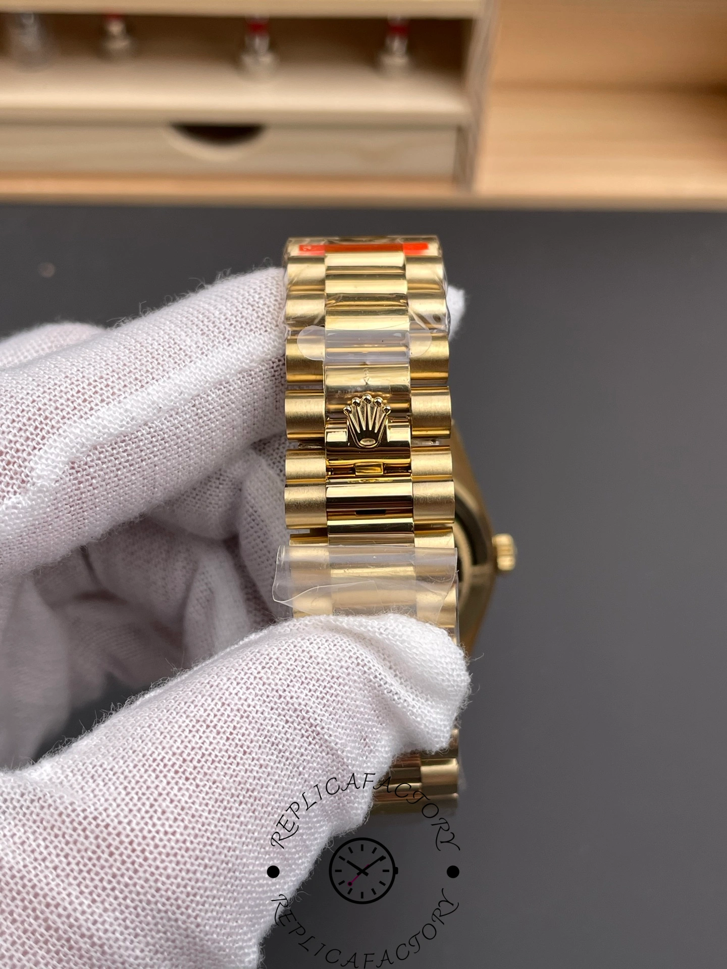 Bracelet clasp of Rolex Day-Date 40 m228238-0005 featuring engraved crown logo.