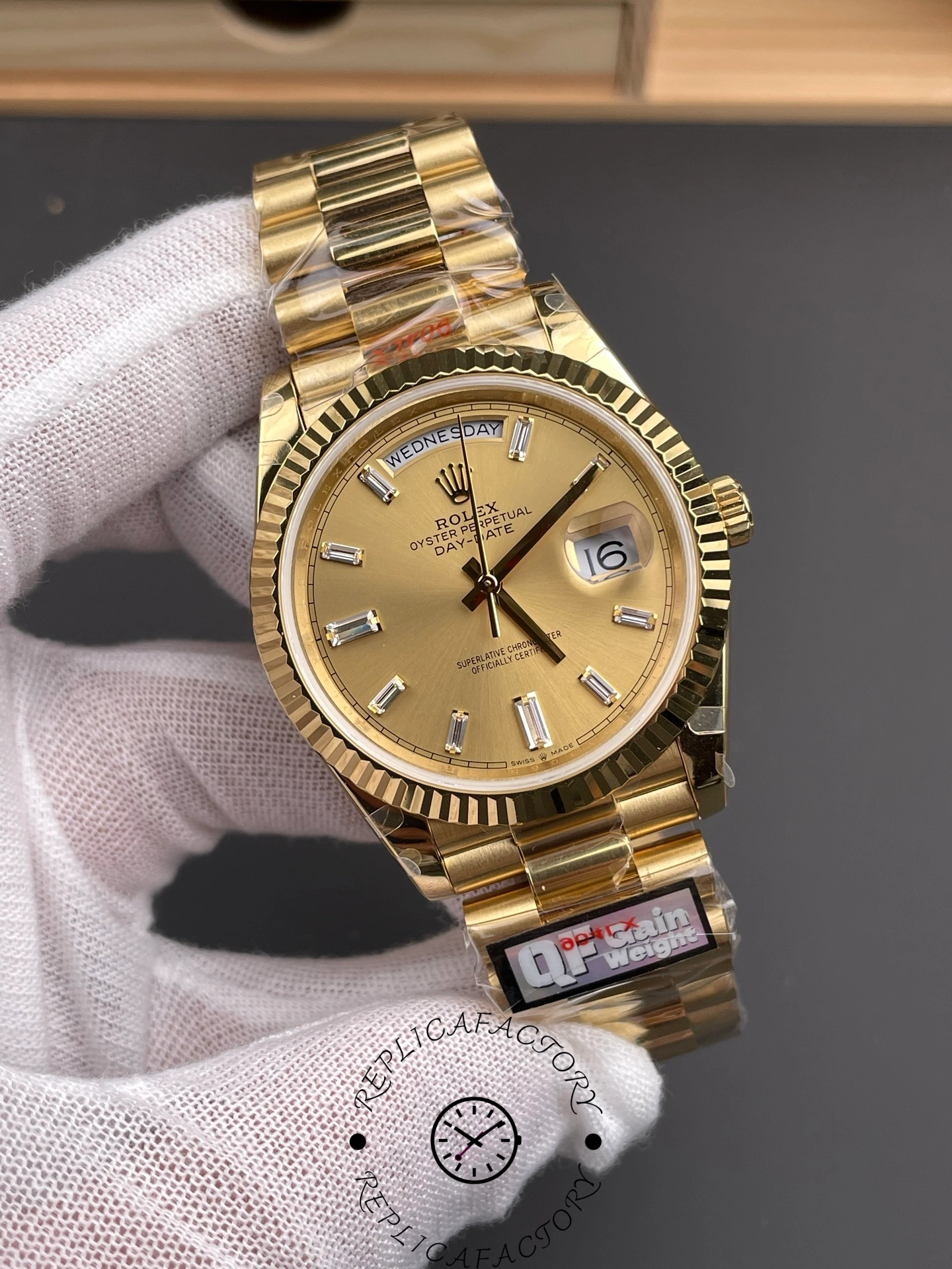 Angled view of Rolex Day-Date 40 m228238-0005 showing gold case and baguette hour markers.