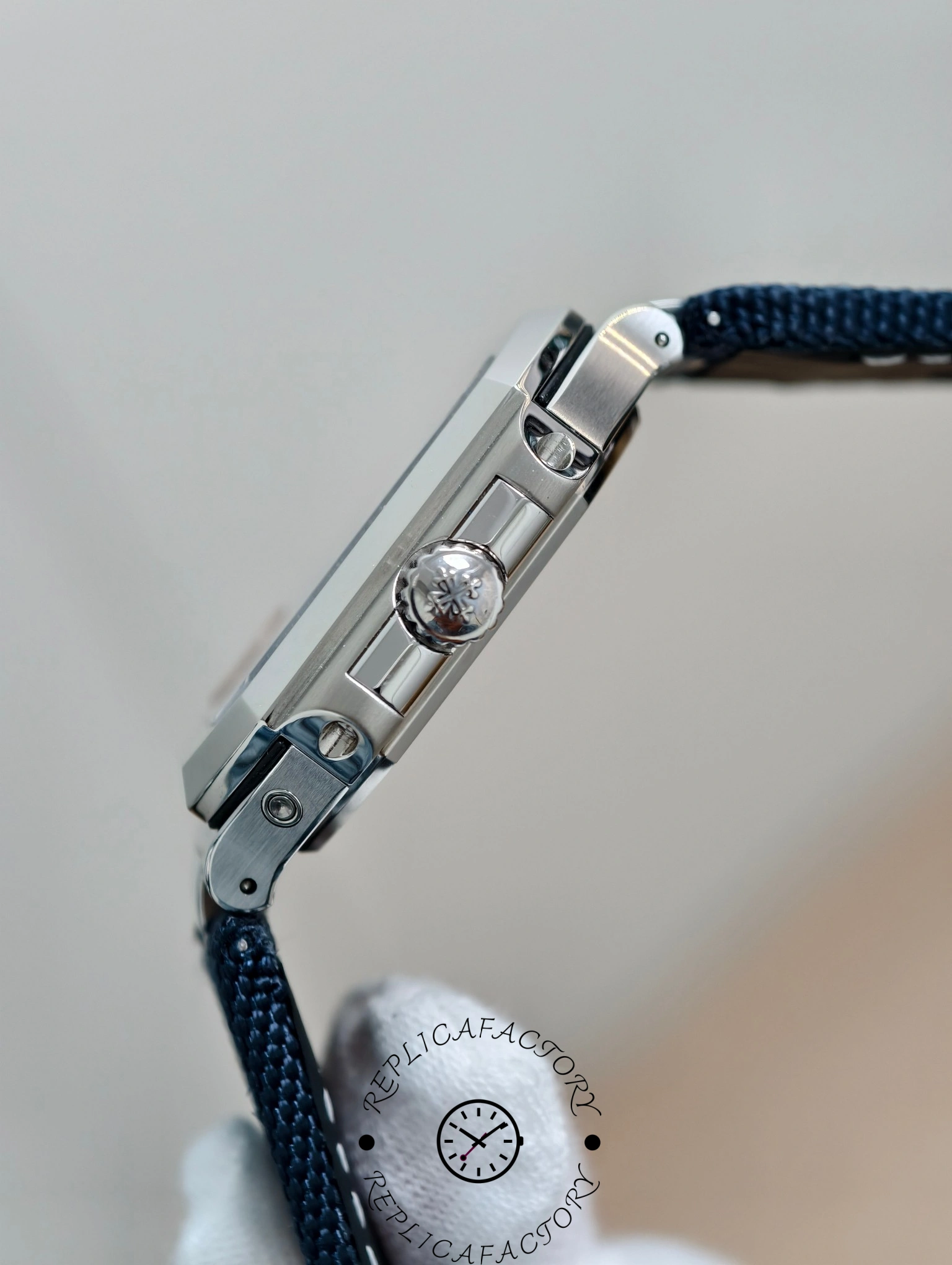 Side view of Patek Philippe Cubitus 5822P-001 showing engraved crown with Calatrava cross.