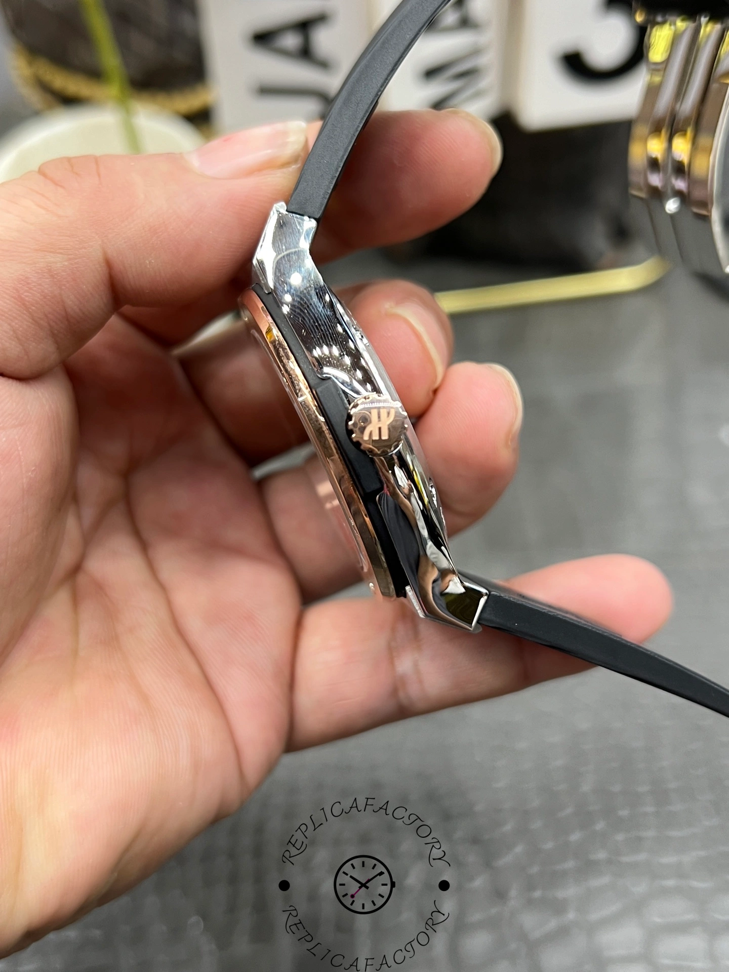 Close-up of Hublot Classic Fusion 42mm 542.NO.1181.RX crown with Hublot logo.