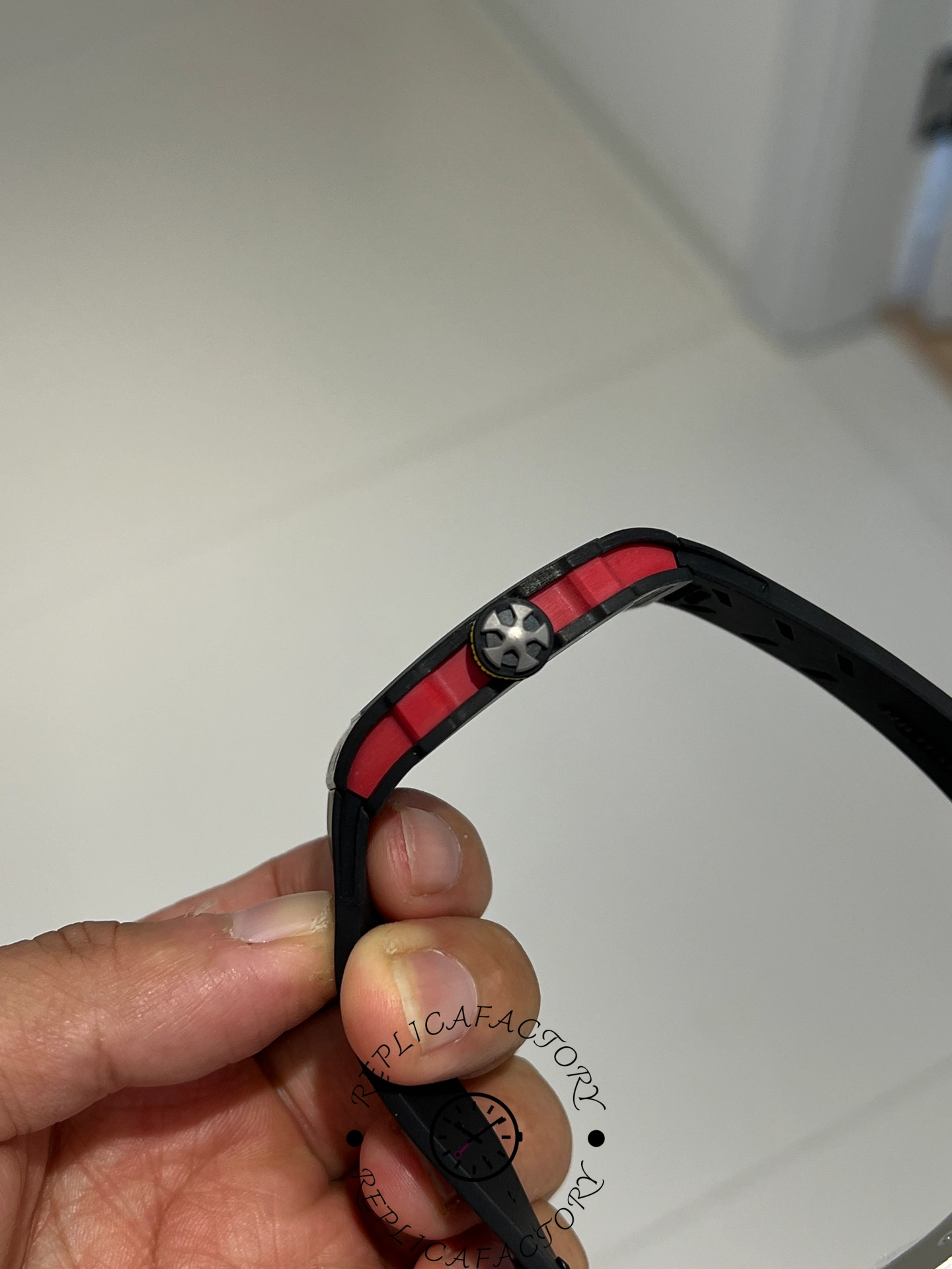 Side view of Richard Mille RM67-02 Alexander Zverev showing red composite layers and screws.