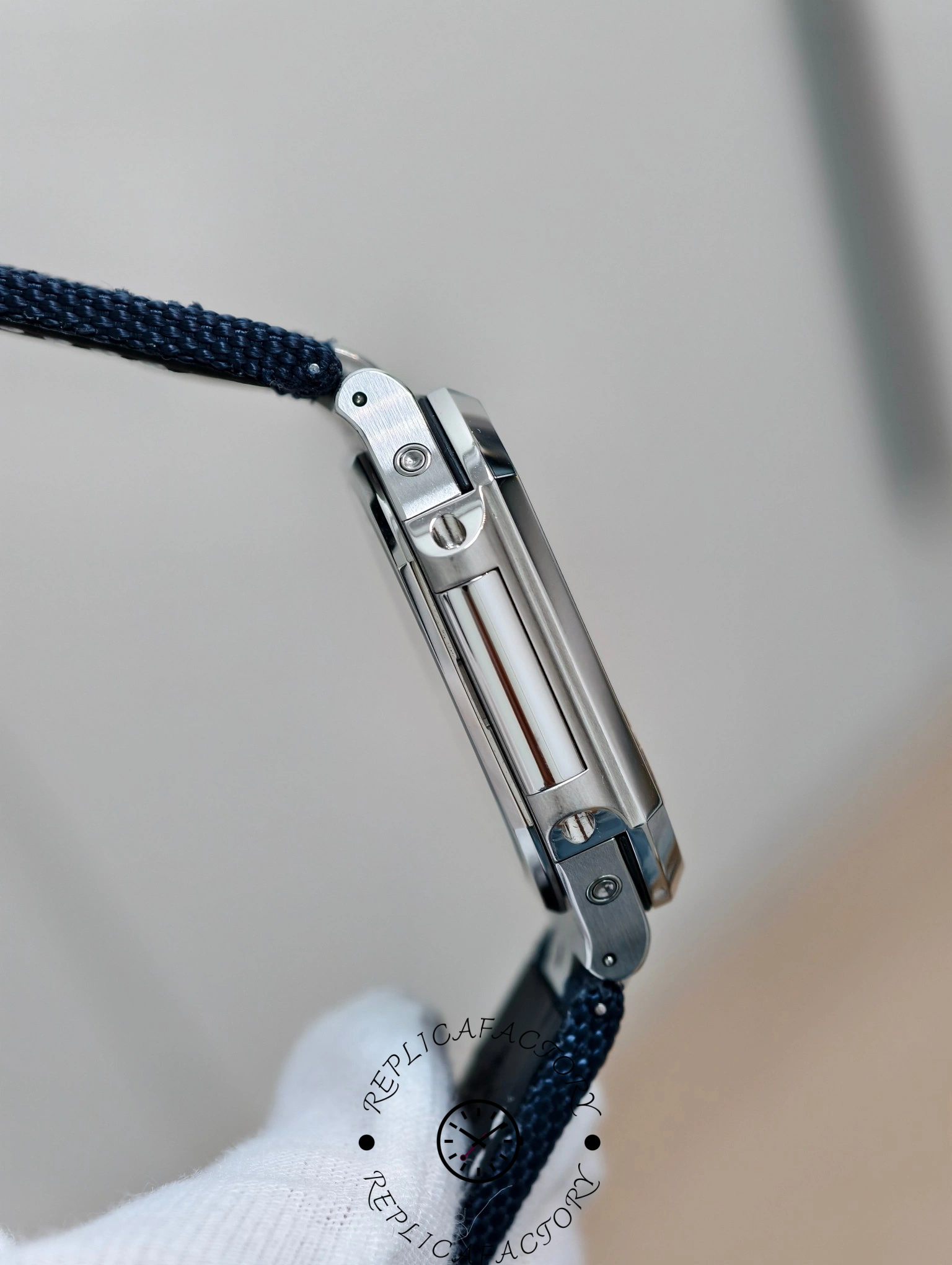 Profile view of Patek Philippe Cubitus 5822P-001 showing polished case edges and screws.