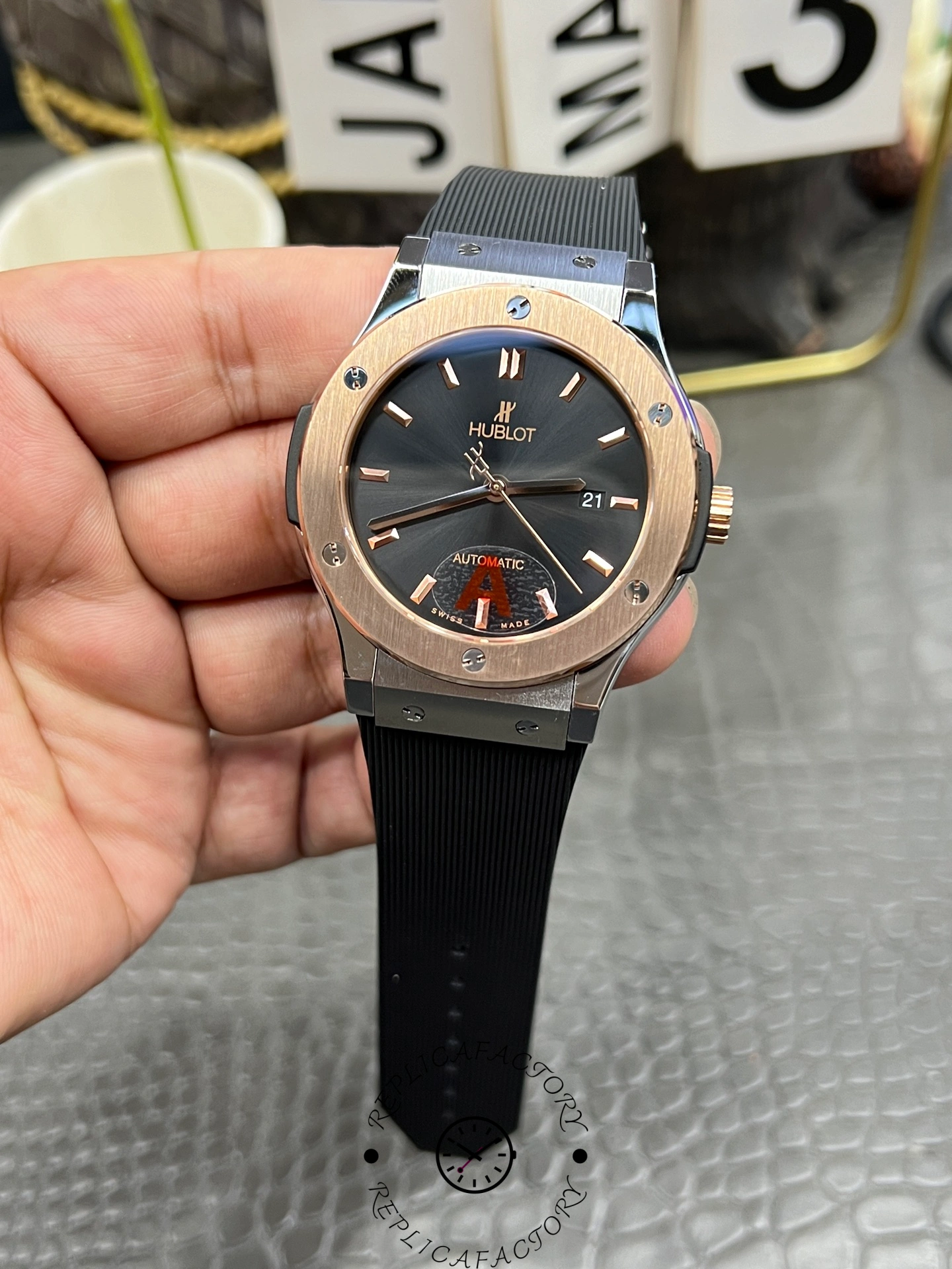 Front angle of Hublot Classic Fusion 42mm 542.NO.1181.RX with date window at 3 o’clock.