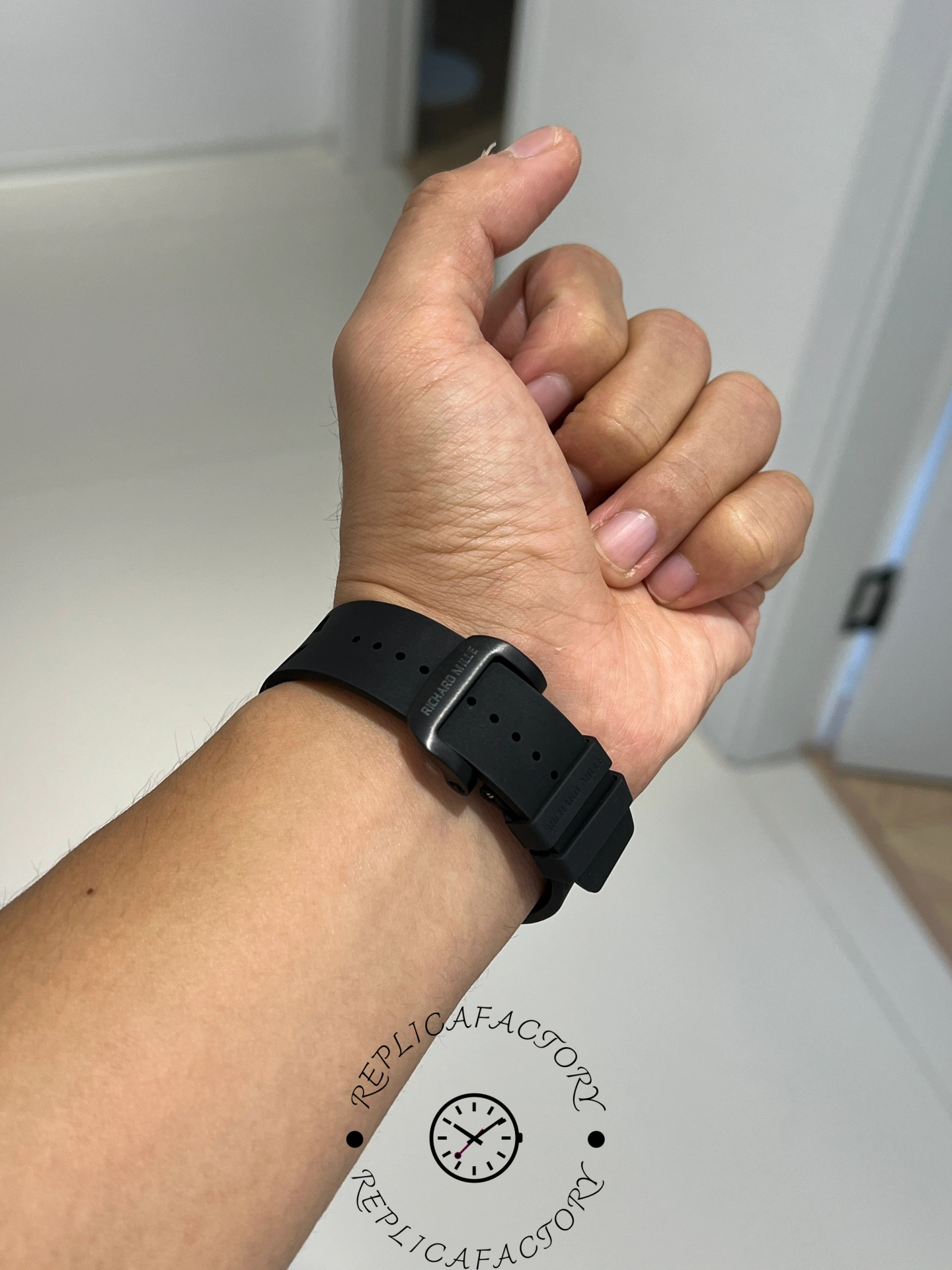 Rear wrist view of Richard Mille RM67-02 showing clasp and rubber strap adjustment holes.