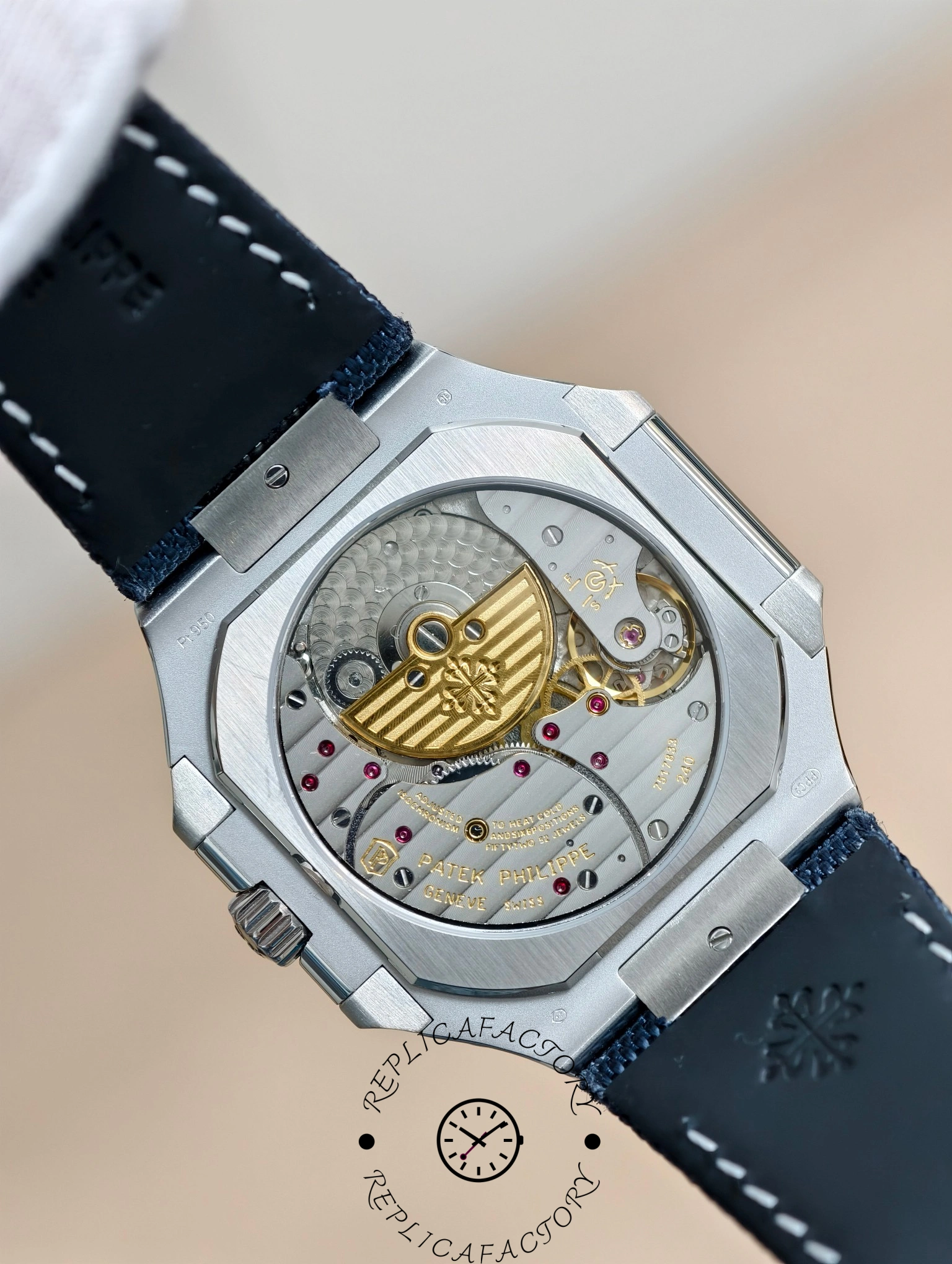 Back view of Patek Philippe Cubitus 5822P-001 revealing automatic movement and rotor engraving.
