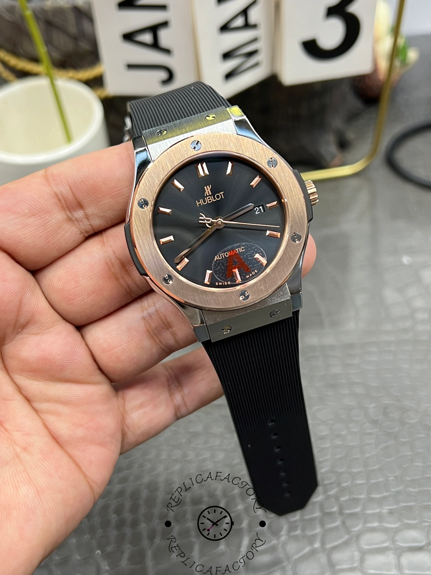 Angled shot of Hublot Classic Fusion 42mm 542.NO.1181.RX showing rose gold bezel and black strap.