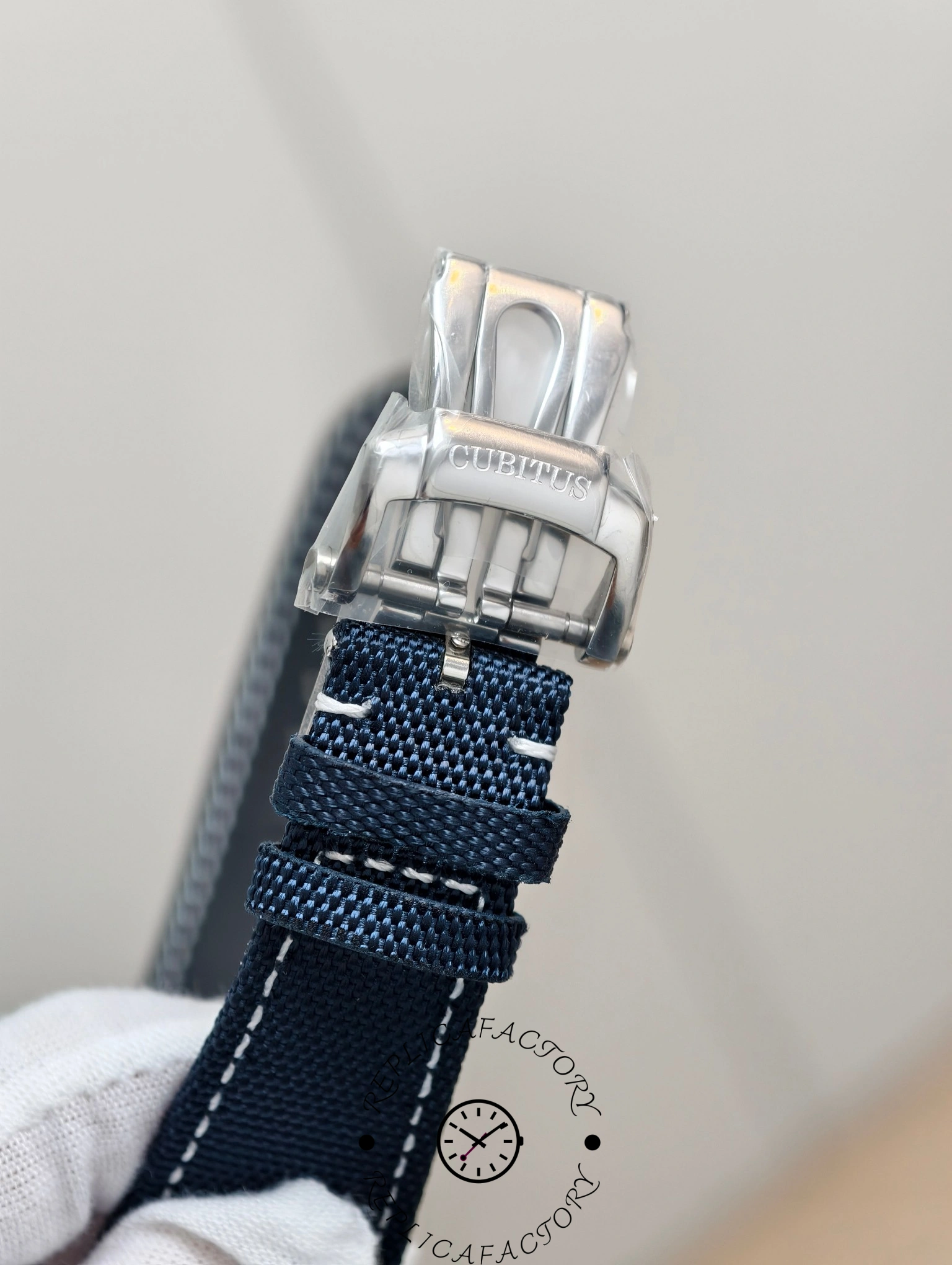 Close-up of Patek Philippe Cubitus 5822P-001 clasp engraved with “Cubitus”.