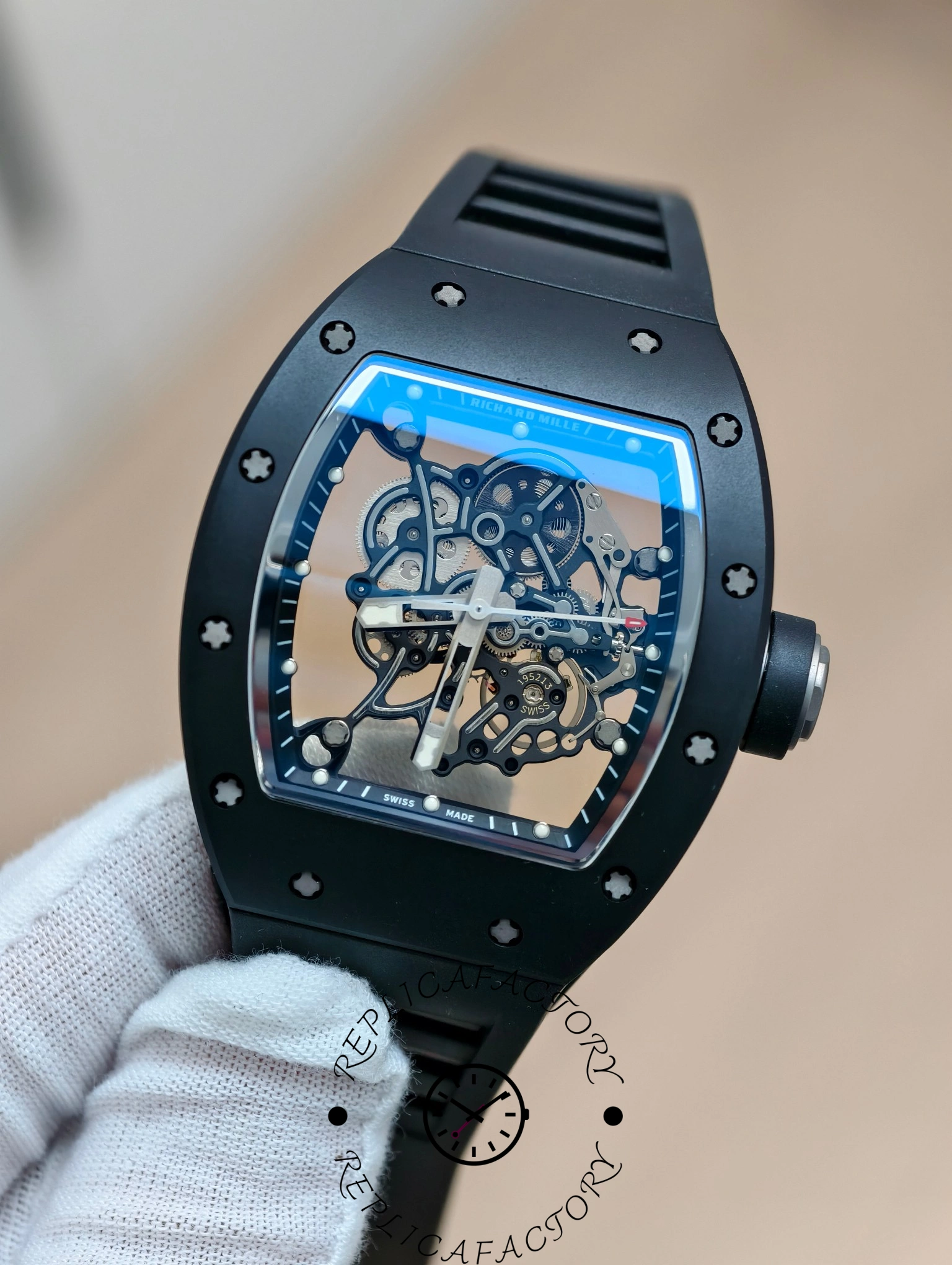 Close-up of Richard Mille RM 055 RMUL2 dial showing gears and hands inside carbon case.