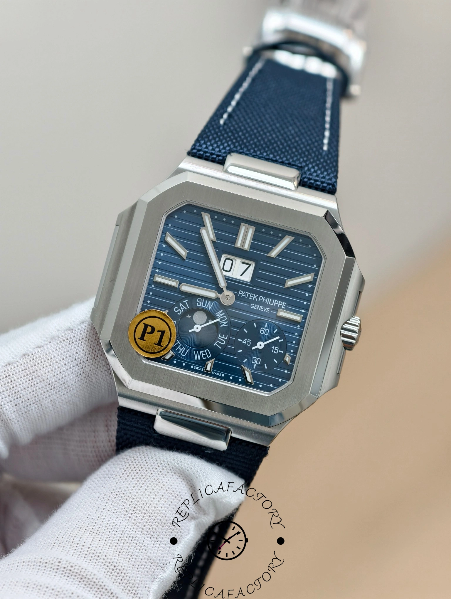 Patek Philippe Cubitus 5822P-001 close-up of day and seconds subdials with white indicators.