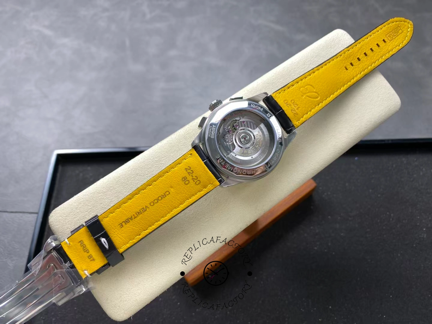 Back view of Breitling Premier B01 AB0118221B1P2 showing transparent caseback and movement.