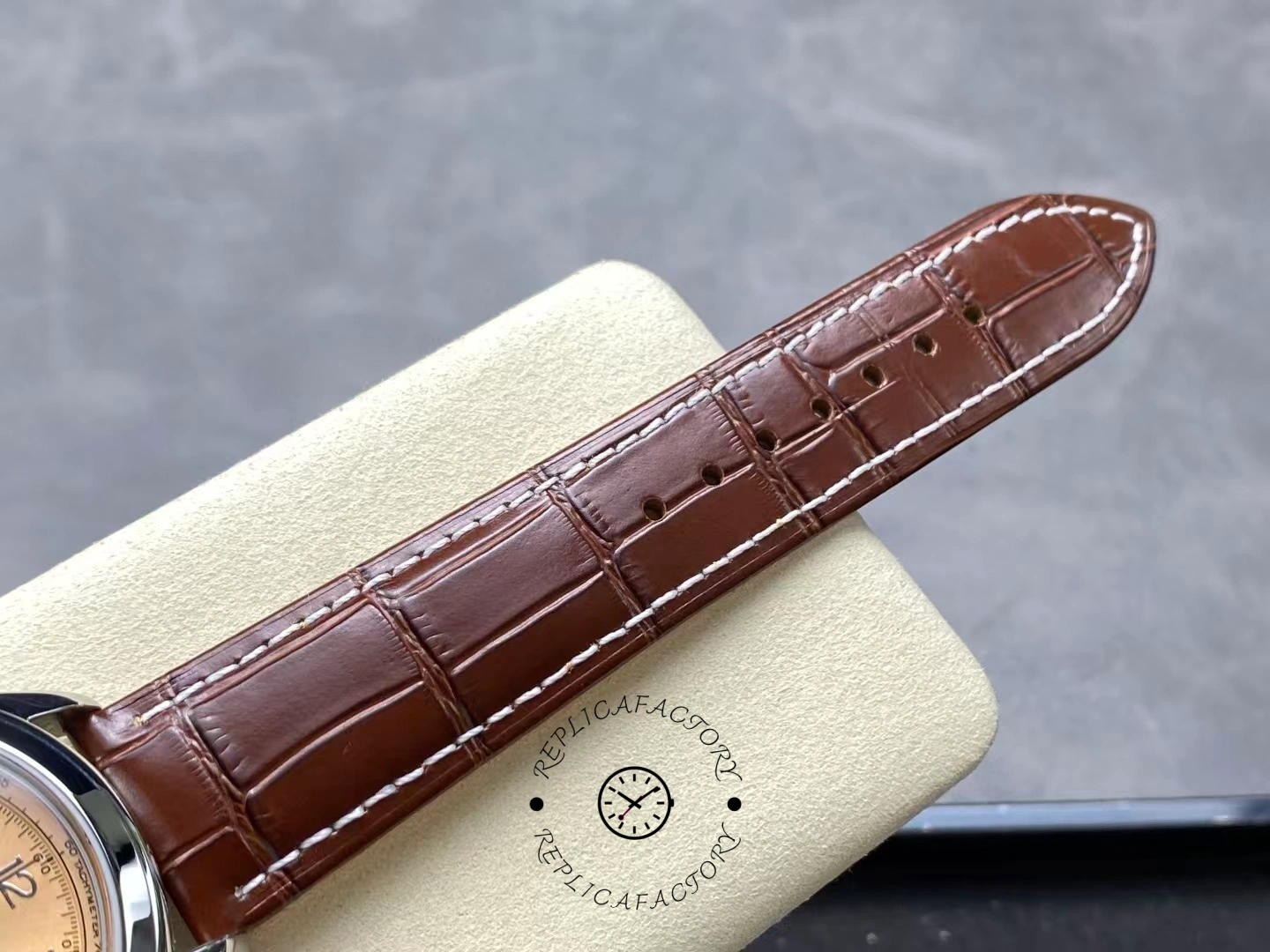 Close-up of Breitling Premier B09 Chronograph 40 AB0930F51H1P1 brown leather strap texture and stitching.