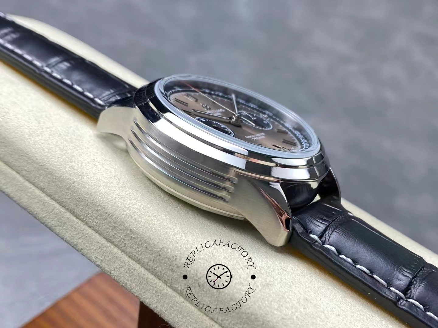 Left side view of Breitling Premier B01 AB0118221B1P2 polished case showing layered lugs.