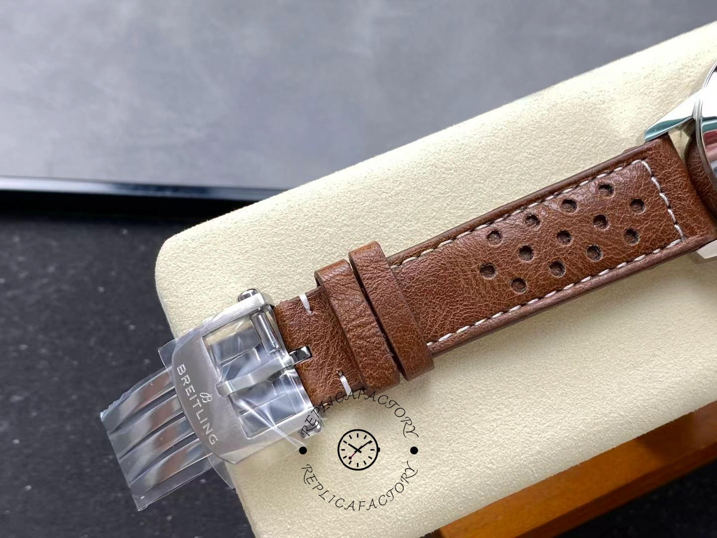 Buckle detail of Breitling Premier Top Time A23310121G1X1 with brown perforated strap.