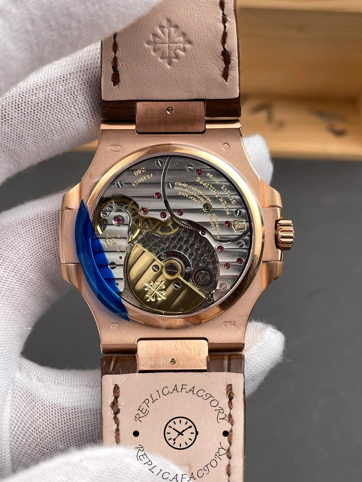 Exhibition caseback of Patek Philippe Nautilus 5724/001 showing movement and rotor engraving.