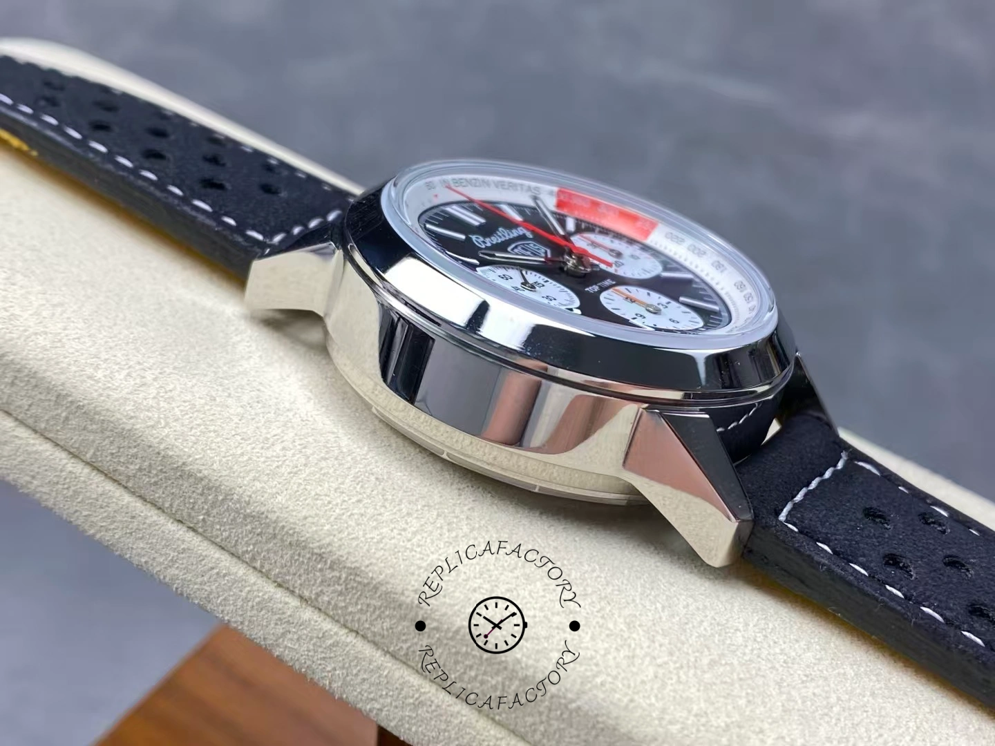 Left side profile of polished steel case on Breitling Top Time B01 Deus AB01765A1B1X1.