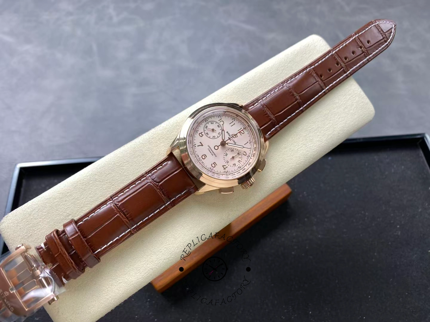 Full view of Breitling Premier B09 Chronograph RB0930371G1P1 with brown strap.