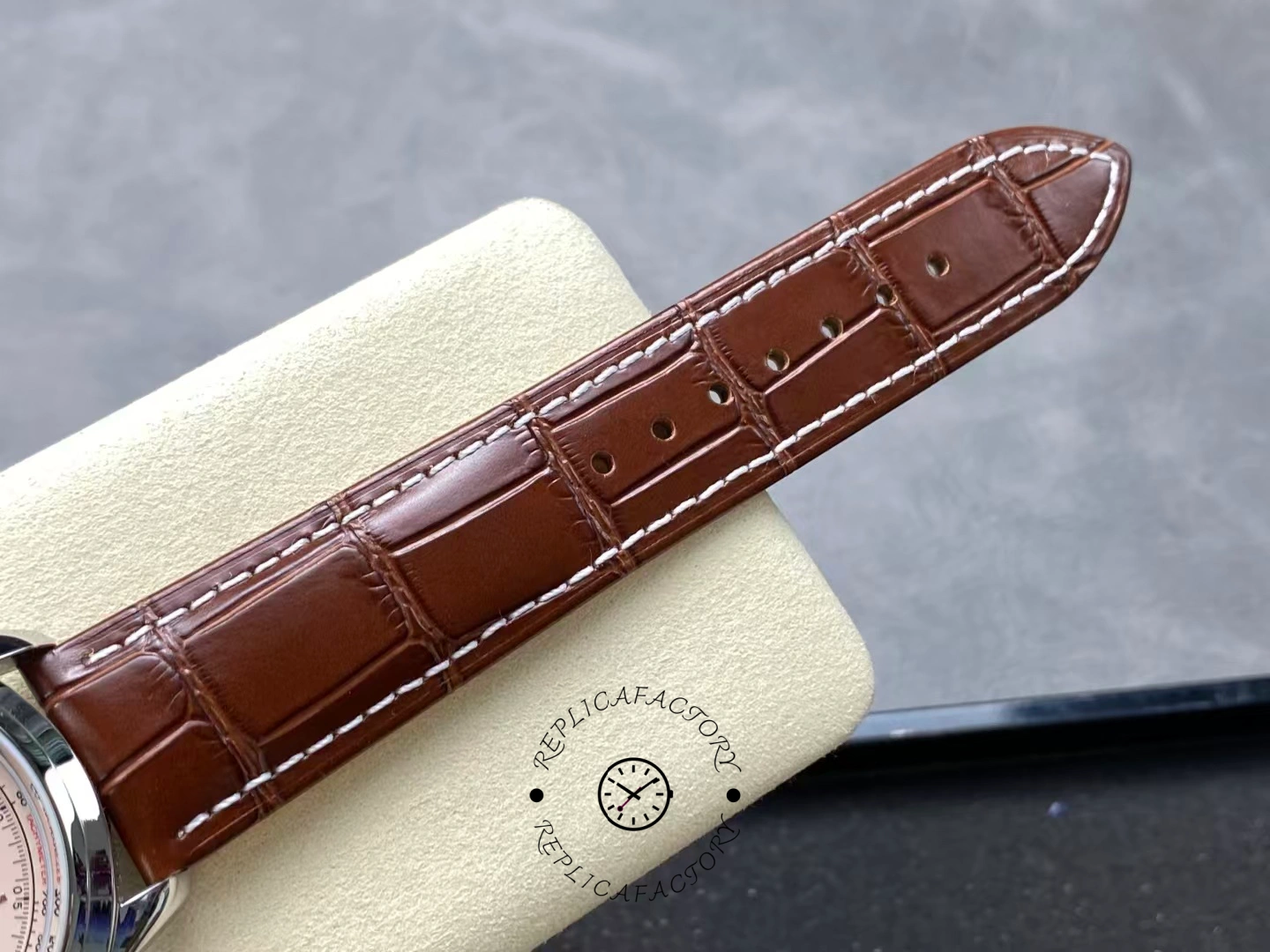 Brown alligator strap of Breitling Premier B01 AB0145211G1P2 showing stitching detail.