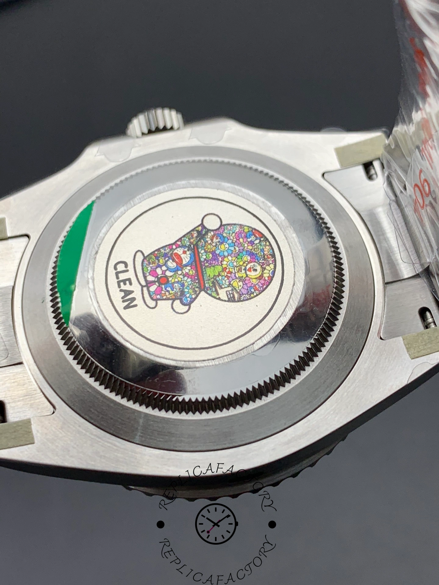 Back view of the Rolex Submariner 116610LN showing the polished case back with sticker.