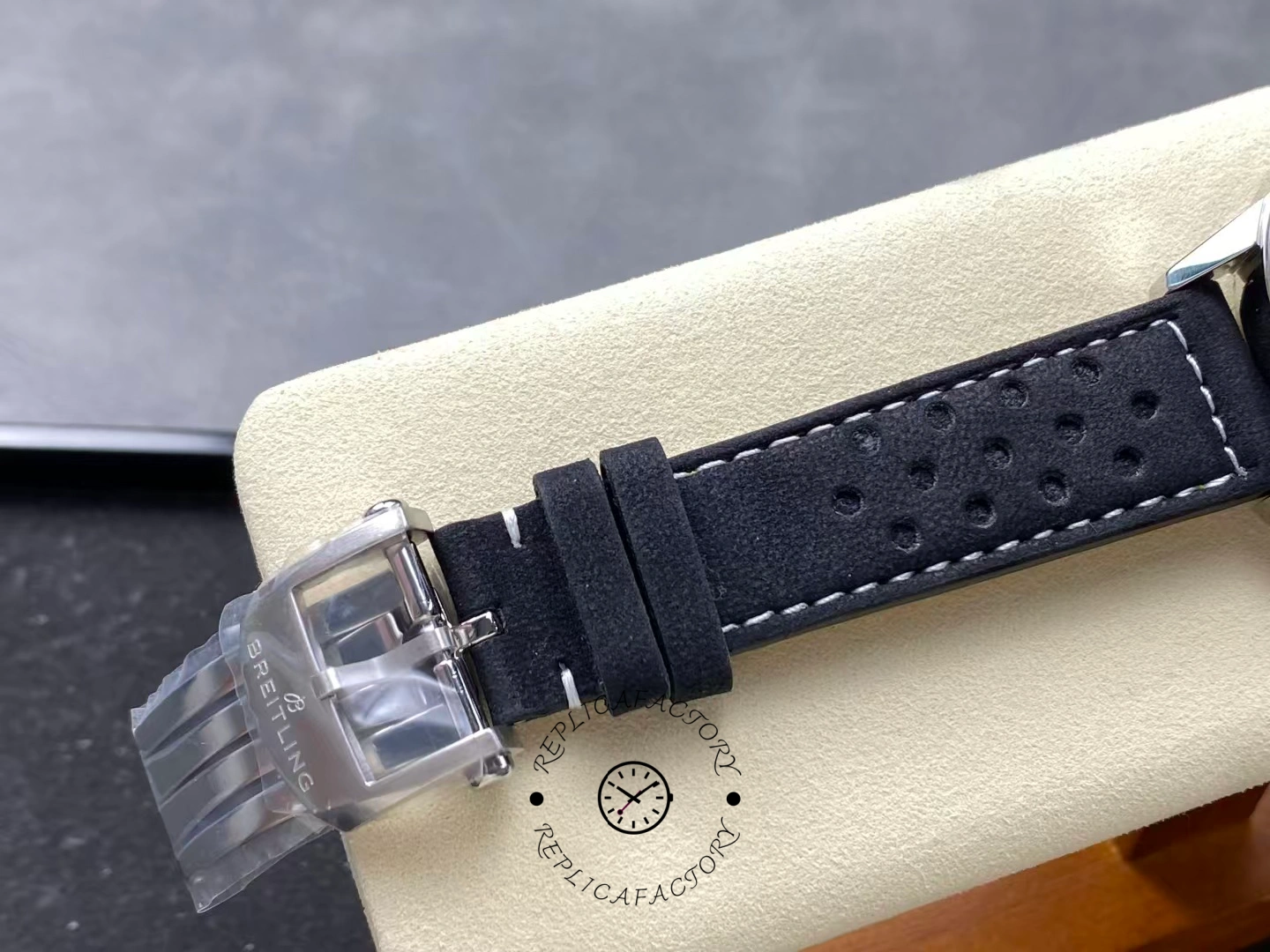 Buckle view of Breitling Top Time B01 Deus Chronograph AB01765A1B1X1 with stitched strap.