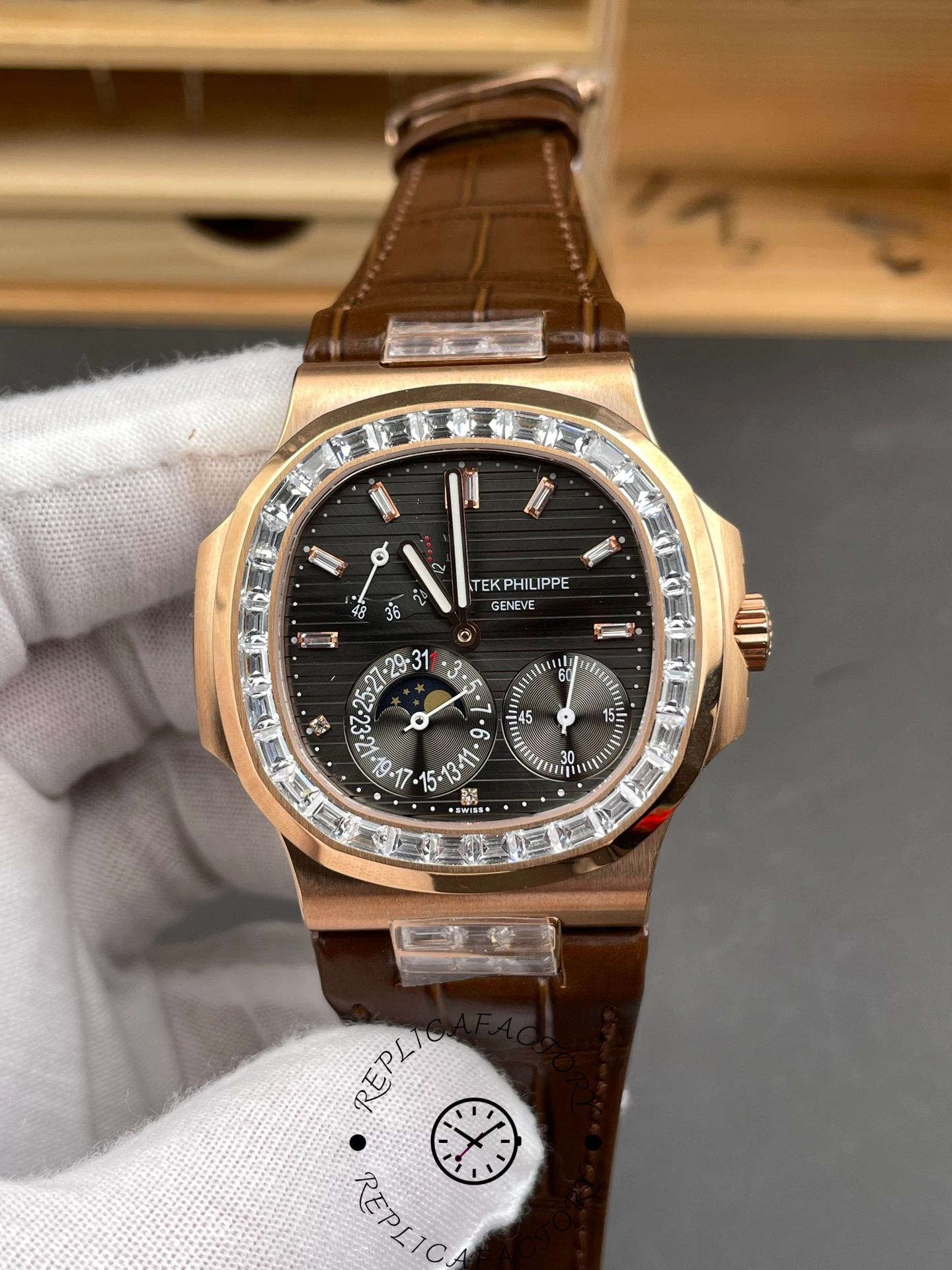 Close-up front view of Patek Philippe Nautilus 5724/001 showing moonphase and date subdials.