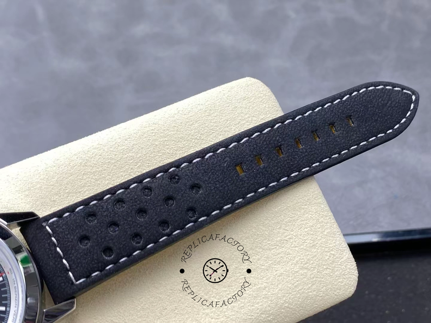 Perforated black leather strap of Breitling Top Time B01 Deus Chronograph AB01765A1B1X1.