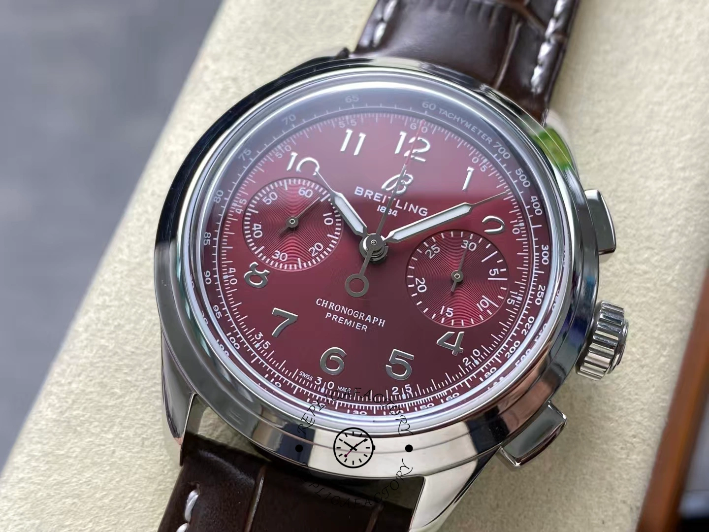 Detailed view of Breitling Premier B09 Chronograph AB0930D41K1P1 burgundy dial.