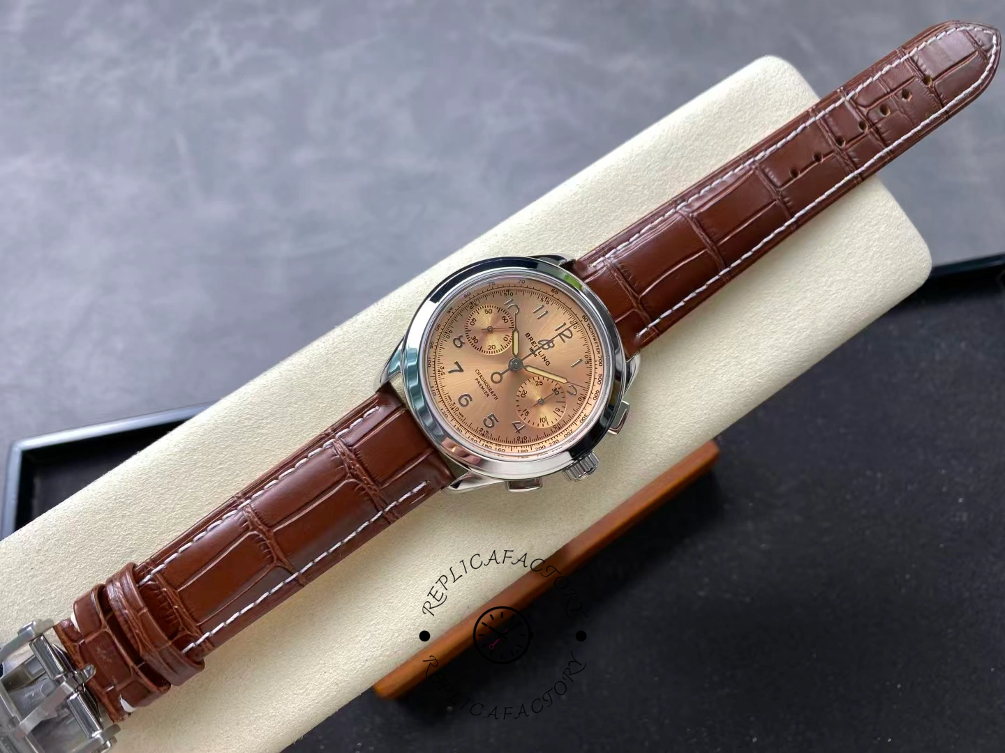 Full view of Breitling Premier B09 Chronograph 40 AB0930F51H1P1 on display cushion.