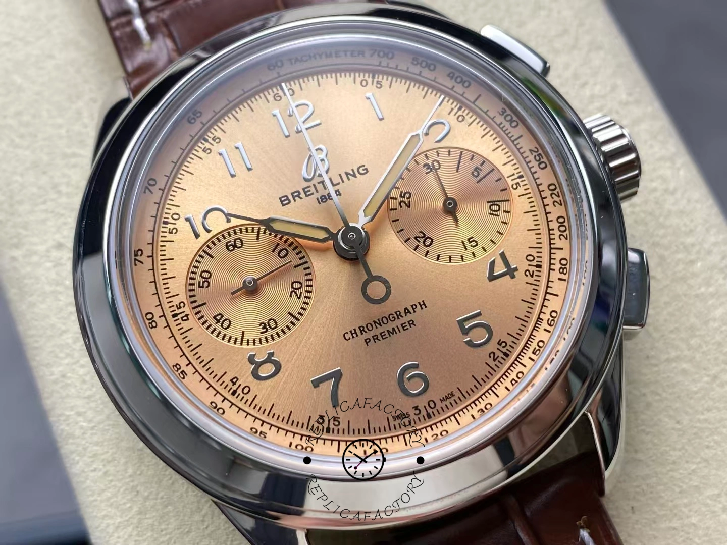 Close-up of Breitling Premier B09 Chronograph 40 AB0930F51H1P1 with champagne dial and brown leather strap.