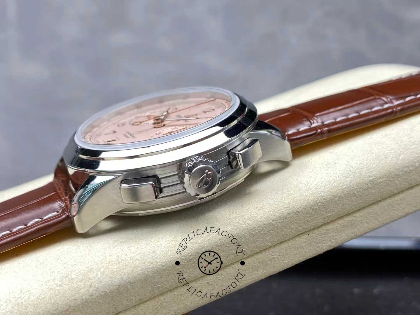 Side view of Breitling Premier B01 AB0145211G1P2 with crown and pushers in focus.