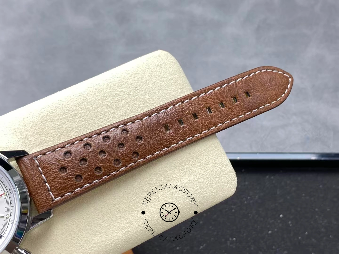 Strap close-up of Breitling Premier Top Time A23310121G1X1 showing stitching detail.