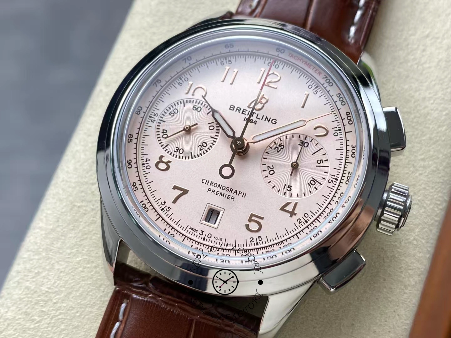Close-up of Breitling Premier B01 Chronograph 42 AB0145211G1P2 cream dial with brown leather strap.