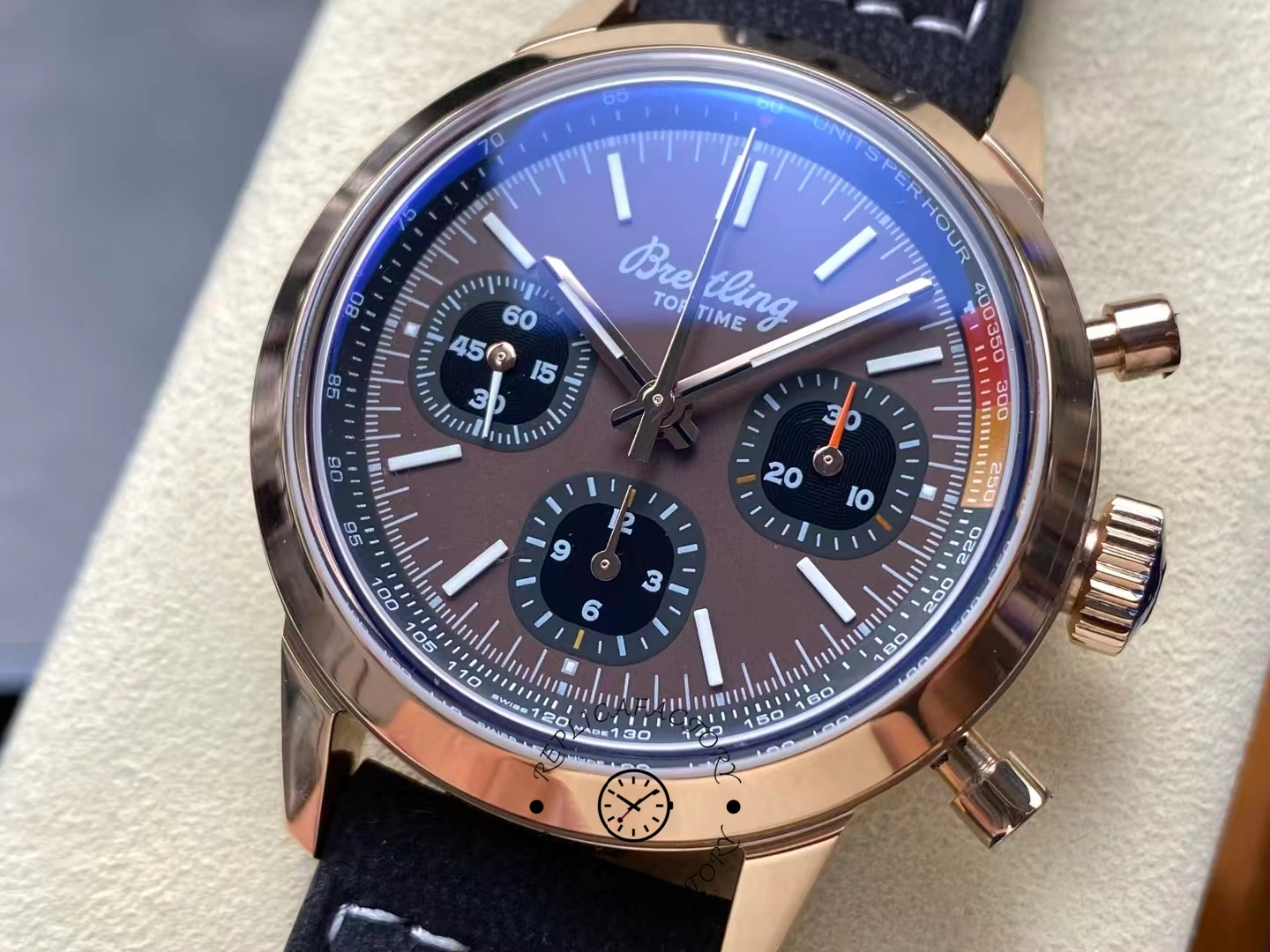 Macro shot of brown dial Breitling Top Time B01 RB01761A1Q1X1 with tachymeter scale.